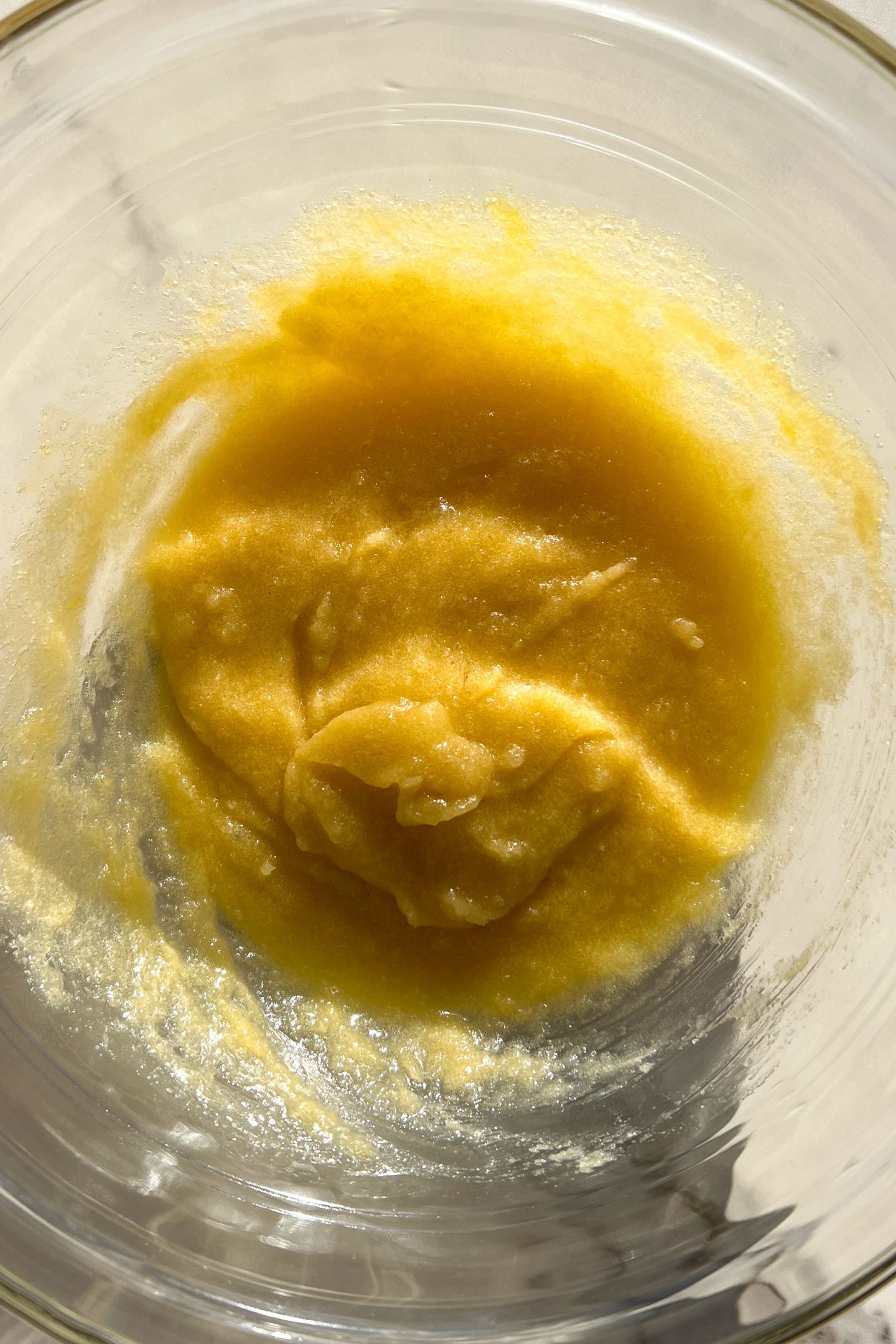 Wet ingredients mixed together in a large mixing bowl.