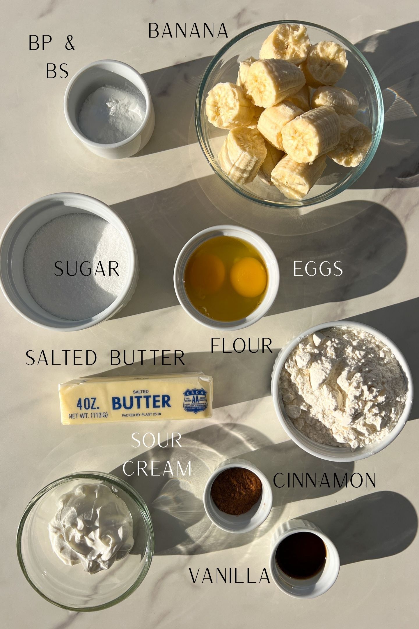 Ingredients measured out in bowls to make banana muffins.