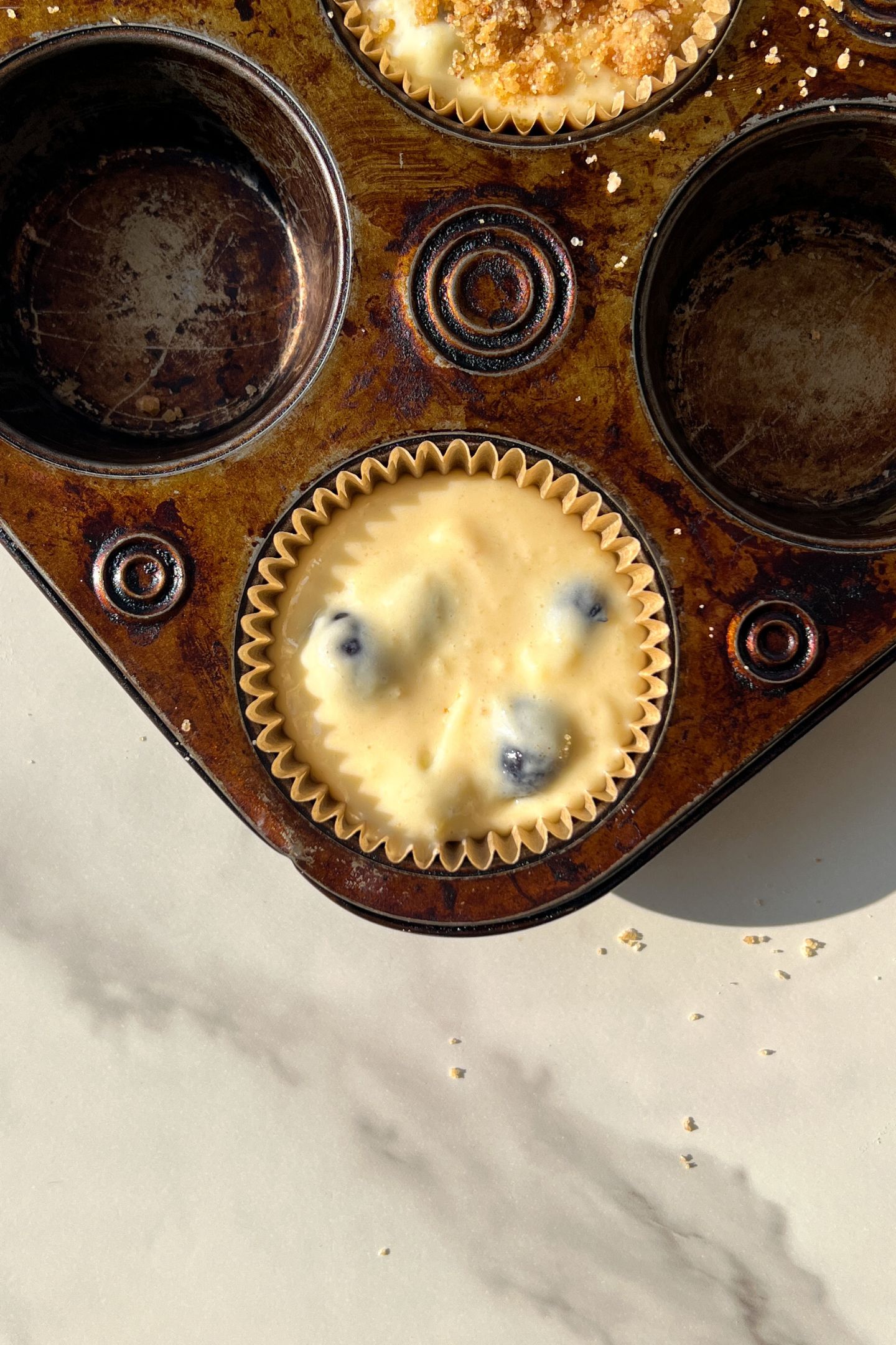 Batter in muffin liners.