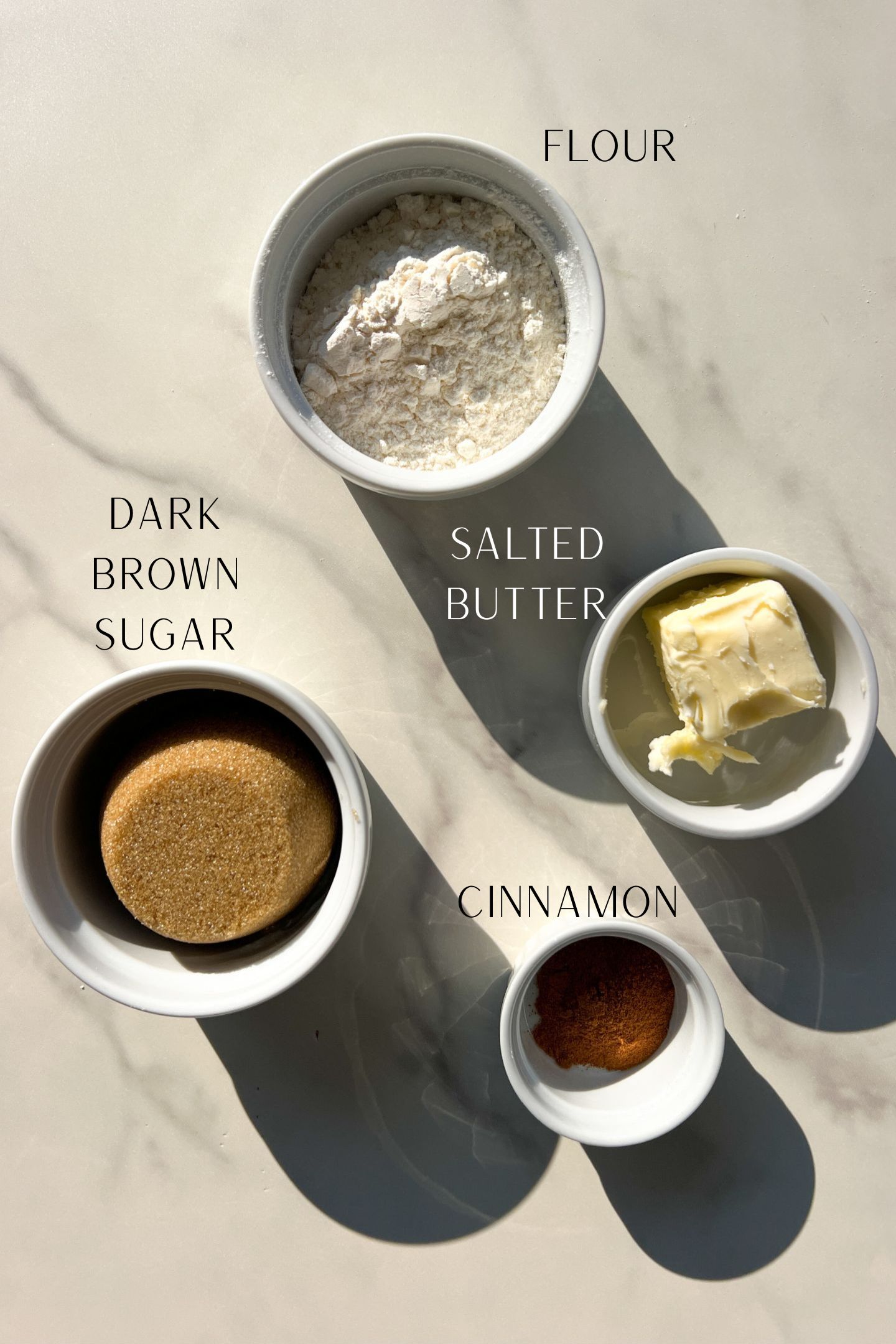 Ingredients measured out in bowls to make the crumb topping.