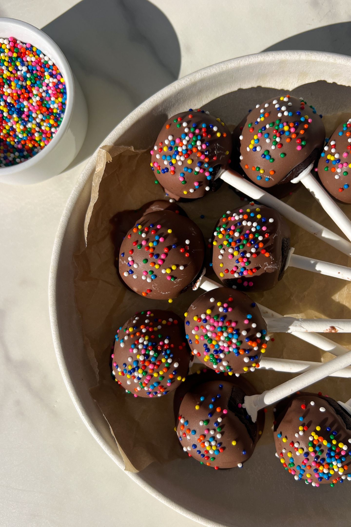 Cake pops on a plate.
