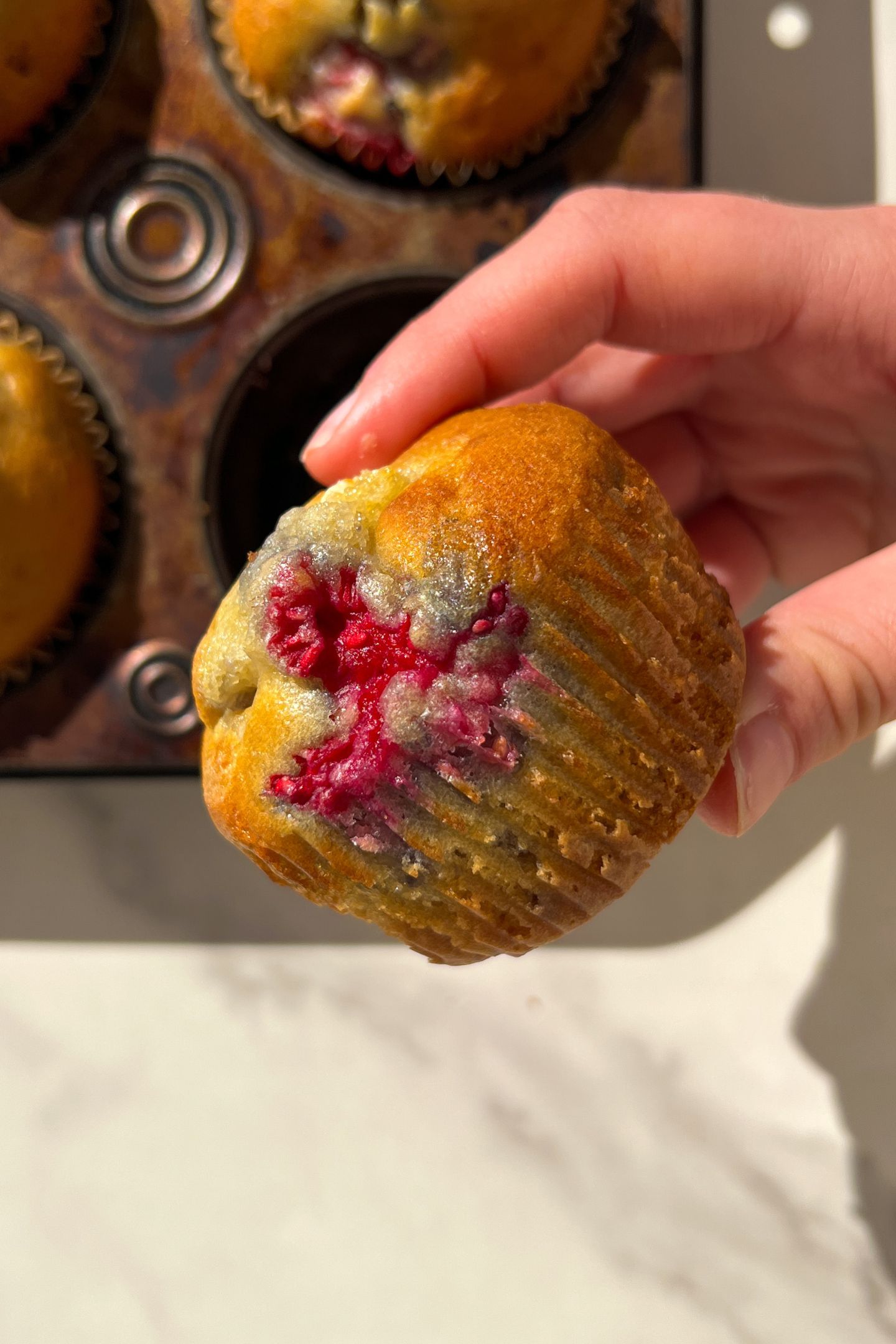 Holding a muffin in my hand.