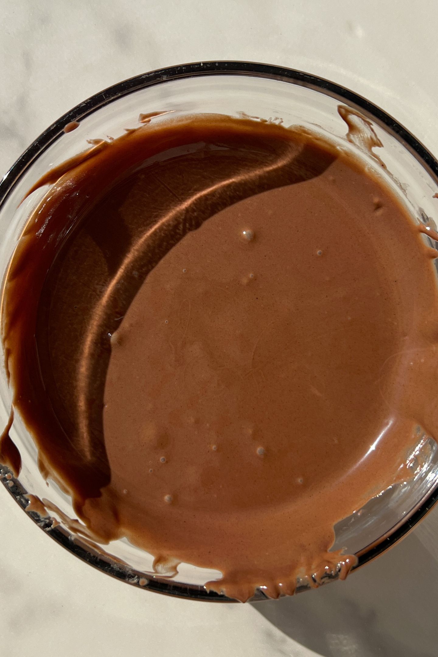 Melted chocolate wafers in a bowl.
