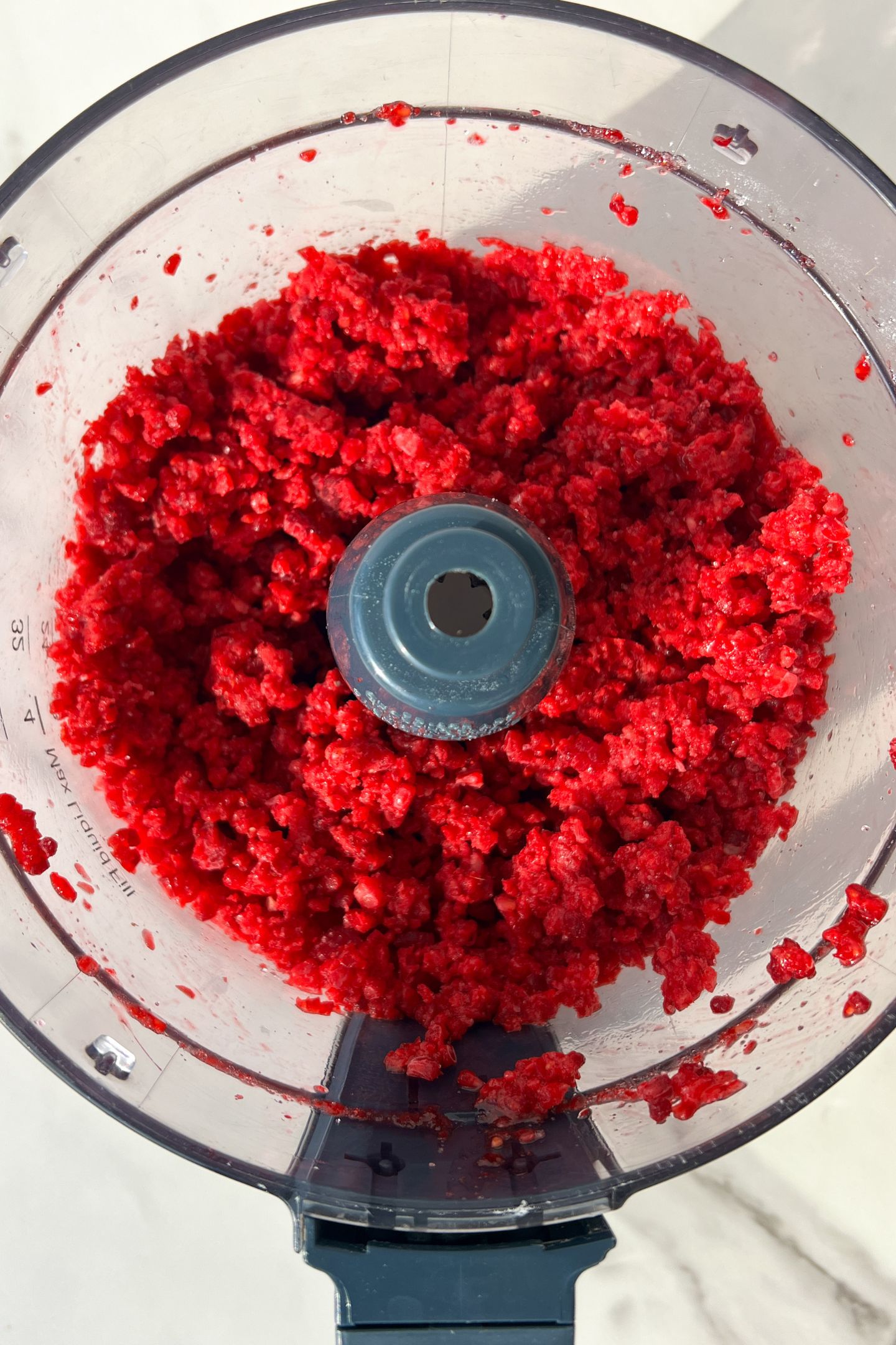 Frozen raspberries and granulated sugar blended in a food processor.