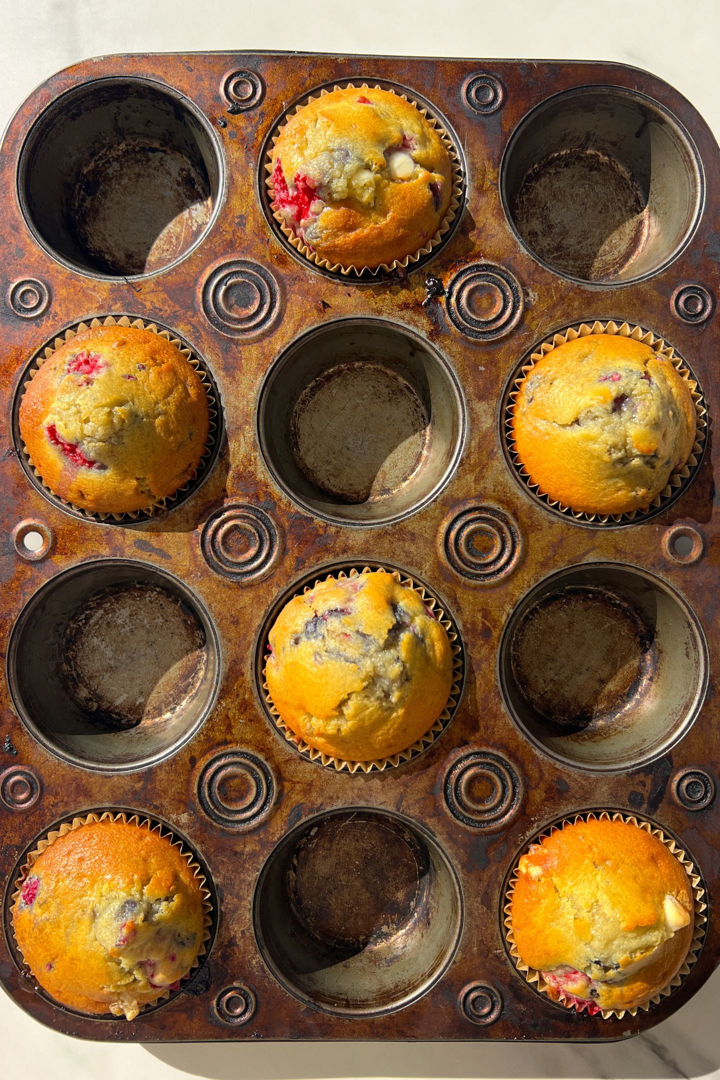 Baked muffins in a muffin tin.