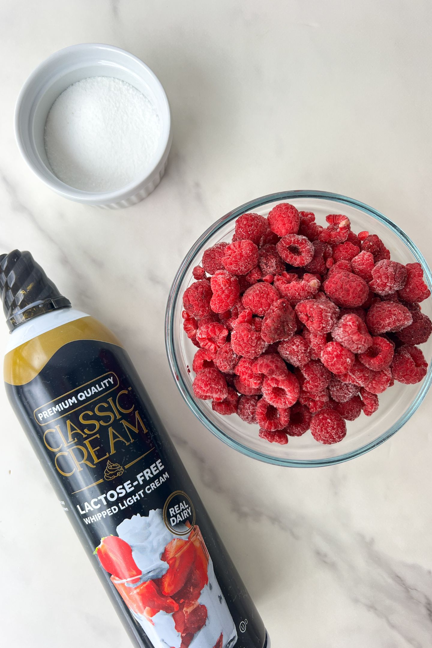 Ingredients to make raspberry whipped cream.