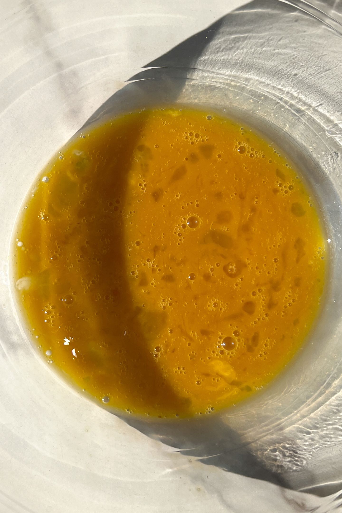 Liquid ingredients in a mixing bowl.