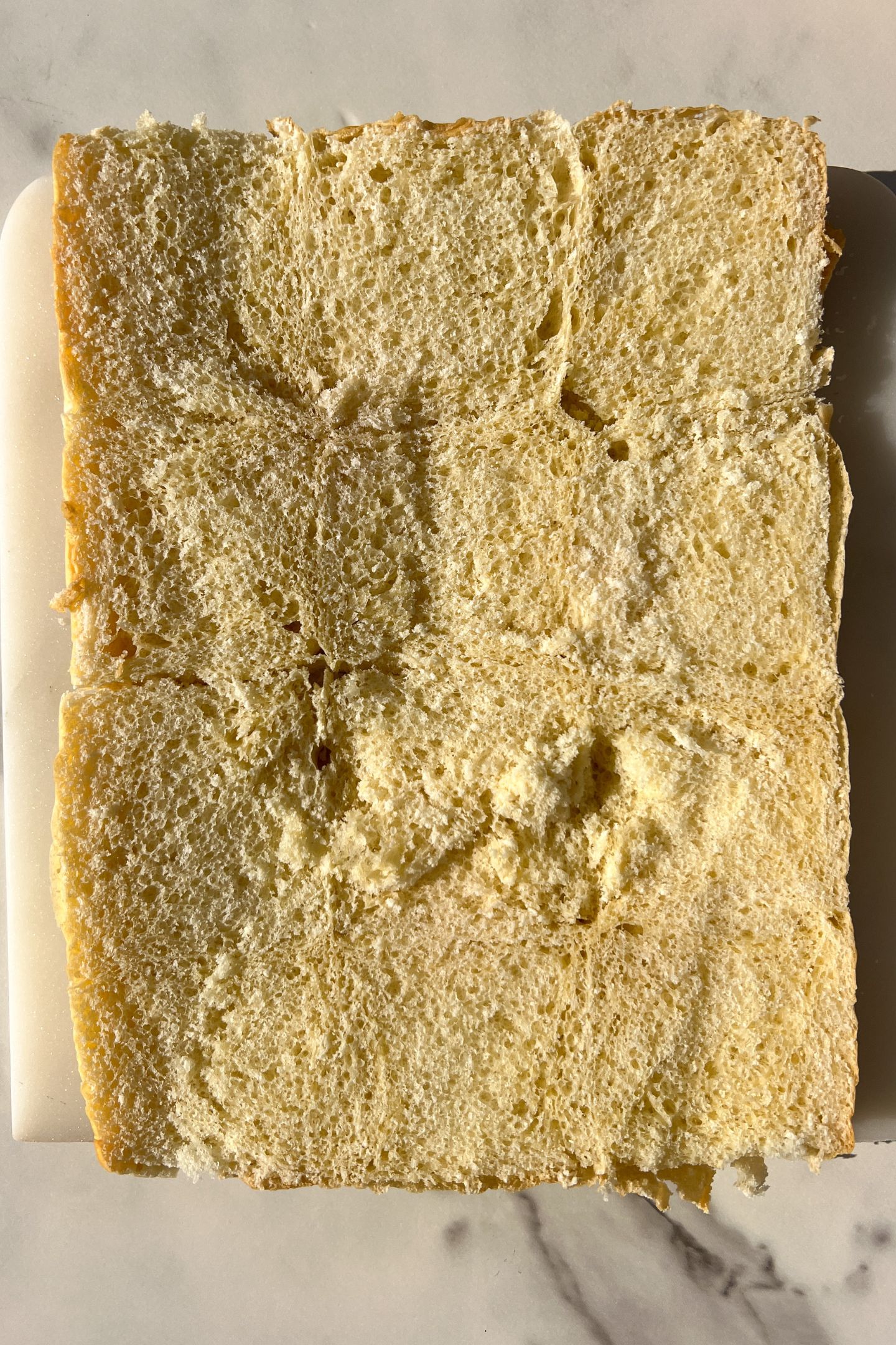 Sliced Hawaiian Roll bottom layer on a platter.