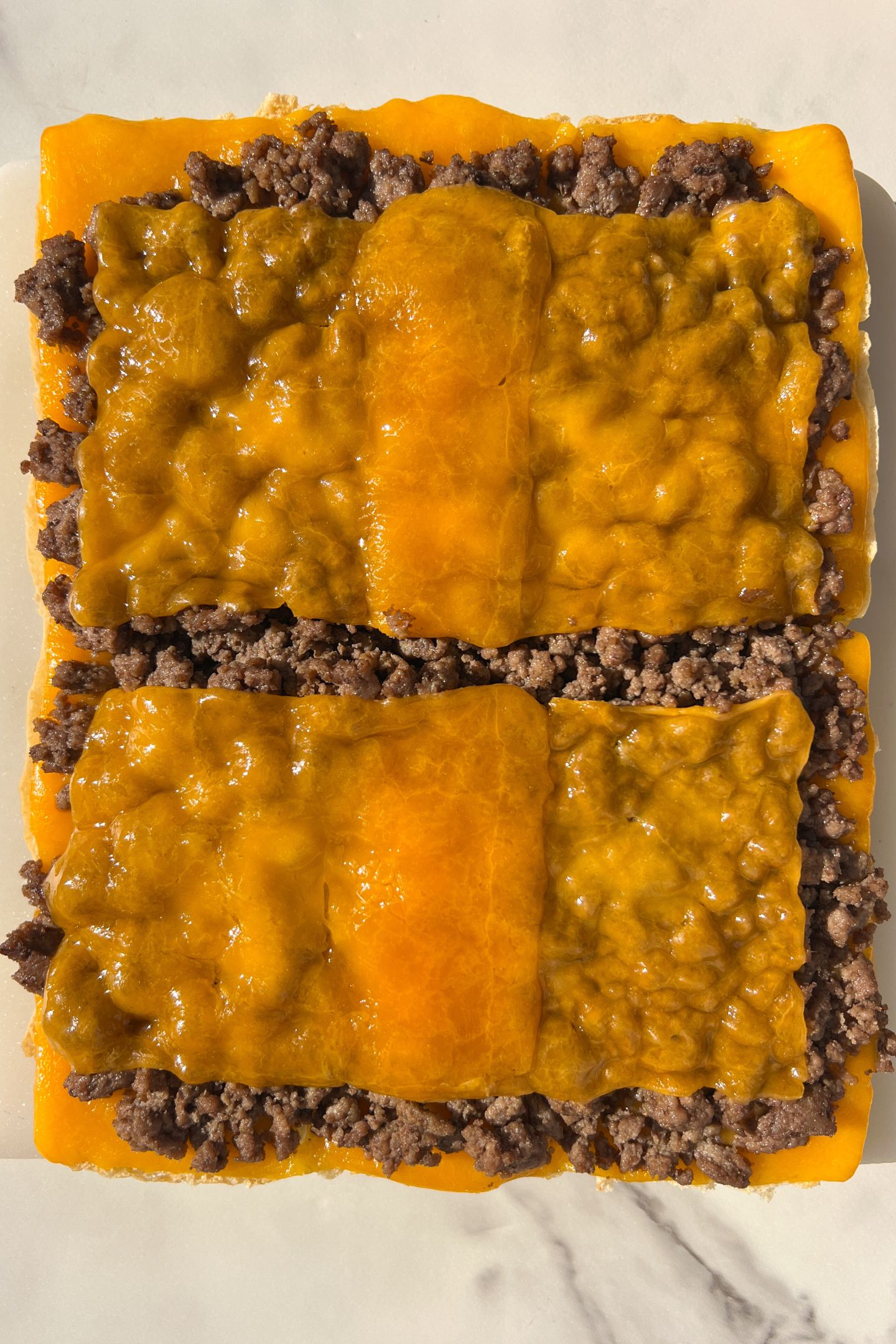 Cheese melted over the ground beef.