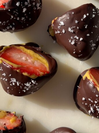 Chocolate Covered Dubai Strawberries with Pistachio Butter on a serving platter.