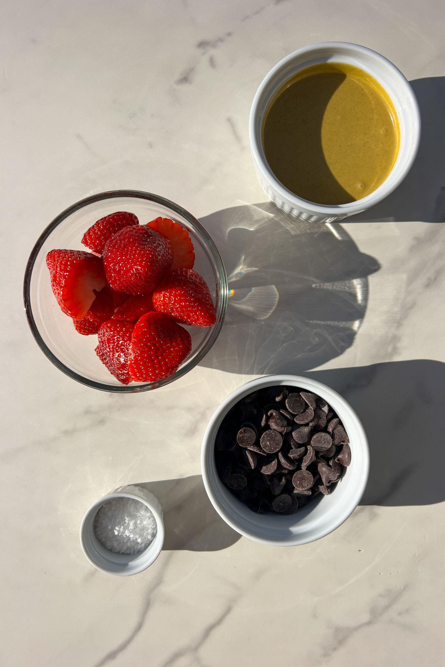 Ingredients measured out in bowls to make Chocolate Dubai Strawberries.