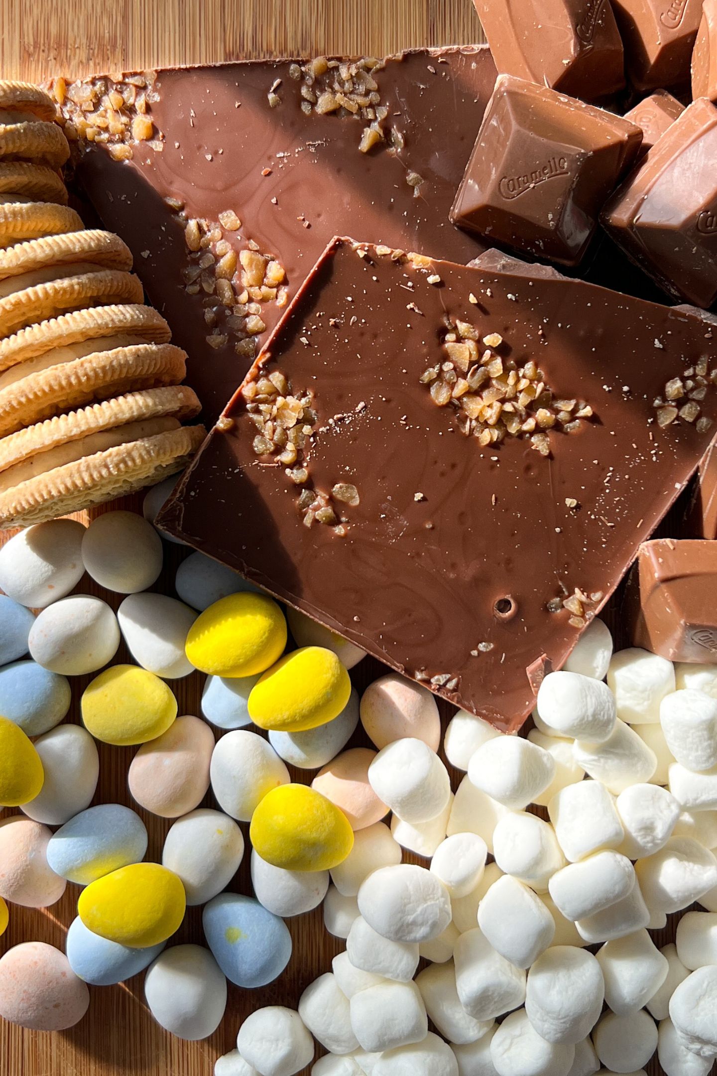 Rocky road candy bar ingredients on a cutting board.