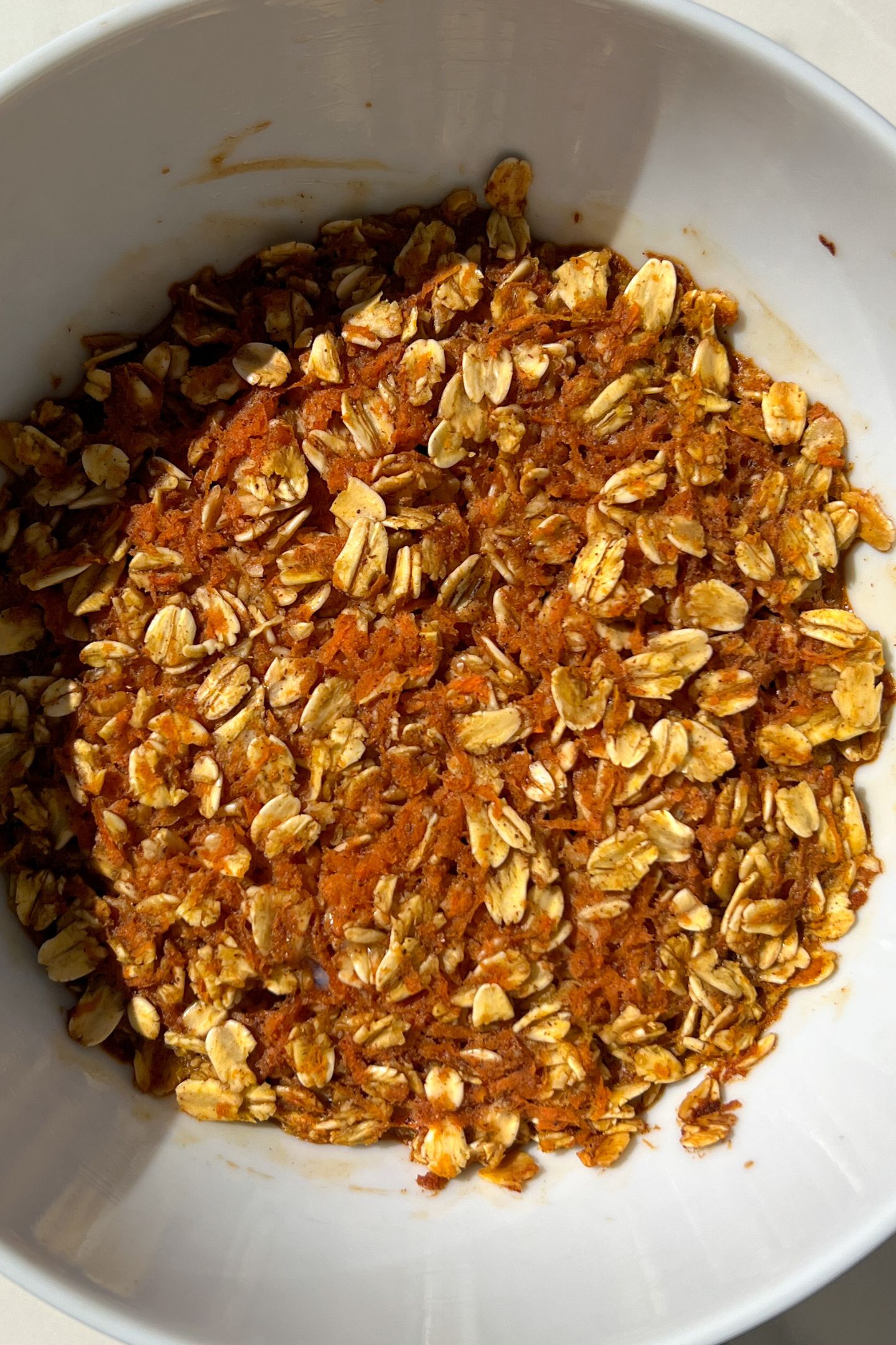 Carrot cake baked oatmeal in a bowl after baking in the oven. 