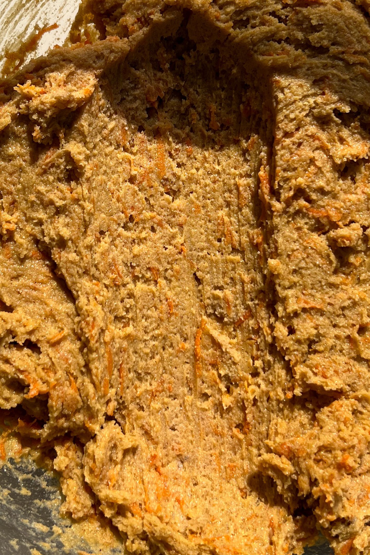 Scooping carrot cookie batter.