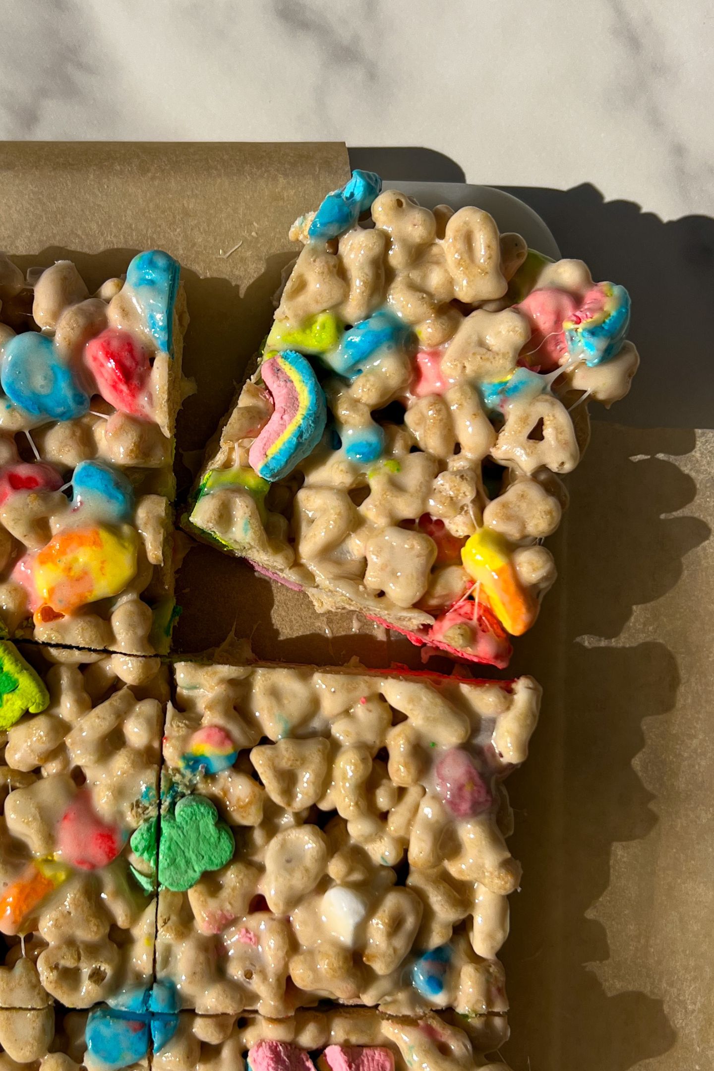 Sliced Lucky Charms Krispie Treats on a serving platter.
