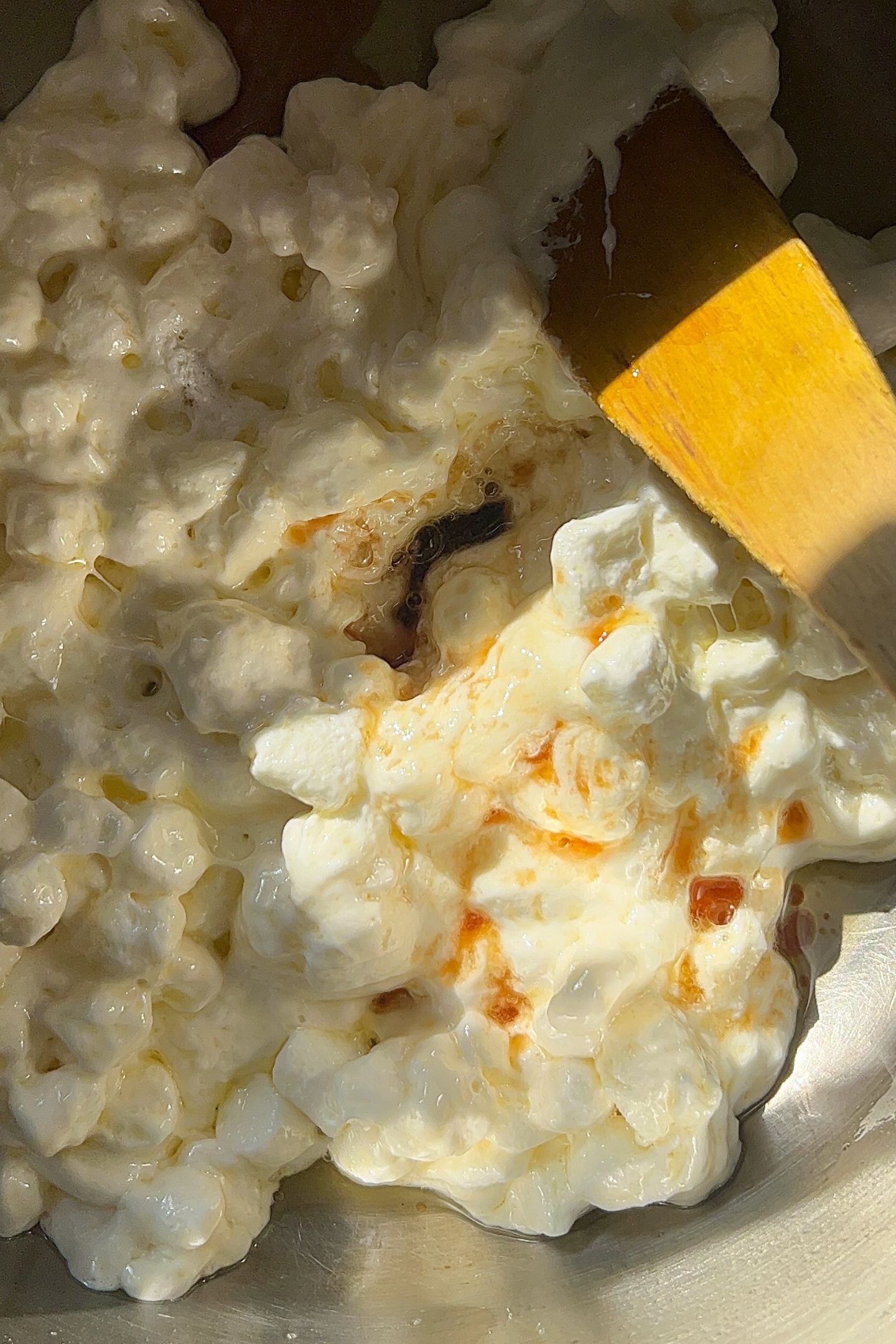 Marshmallows and vanilla added to the pot with butter.