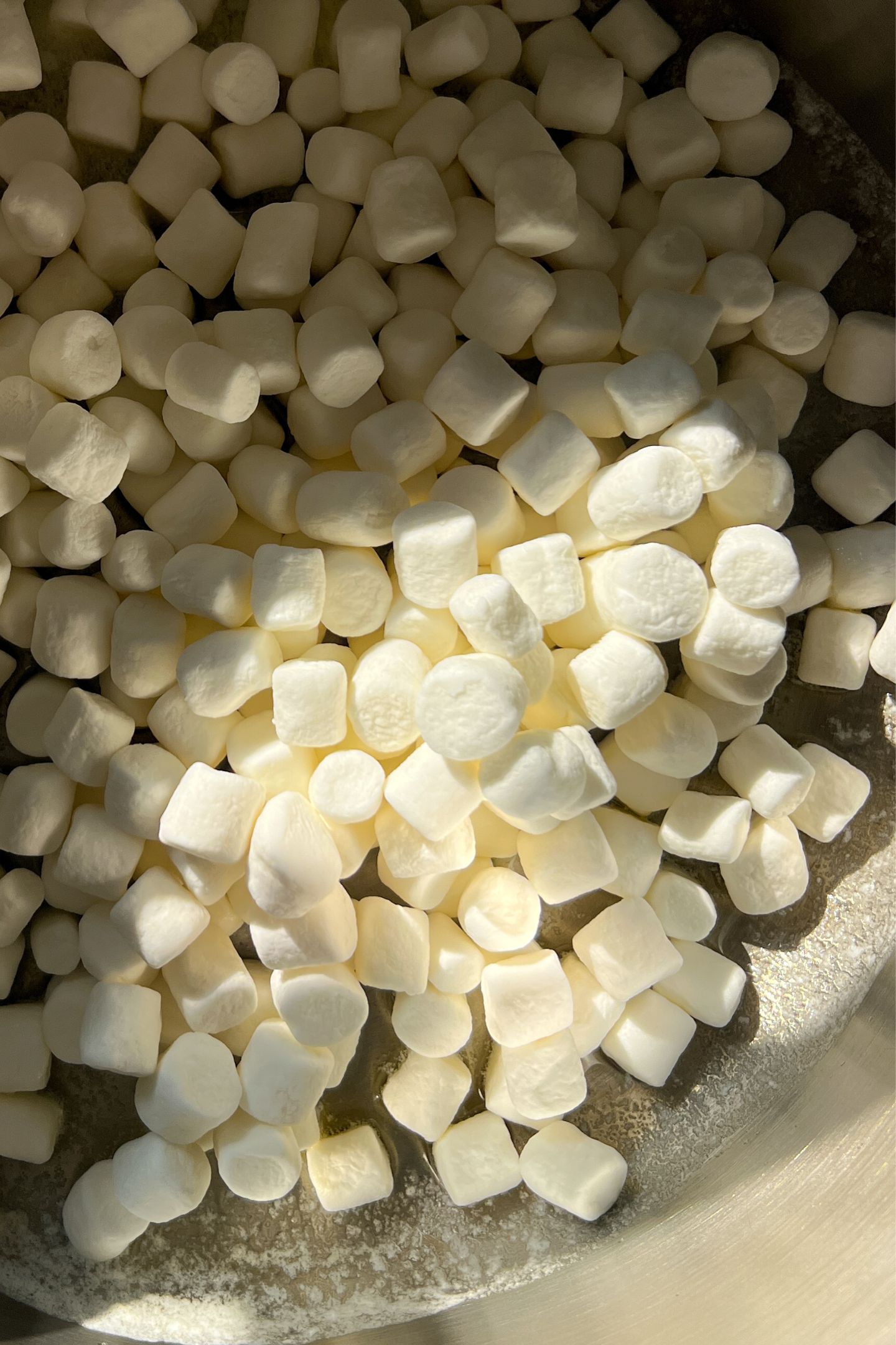 Marshmallows added to the pot with butter.