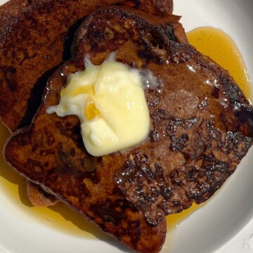 Cinnamon Raisin French Toast topped with butter and maple syrup.