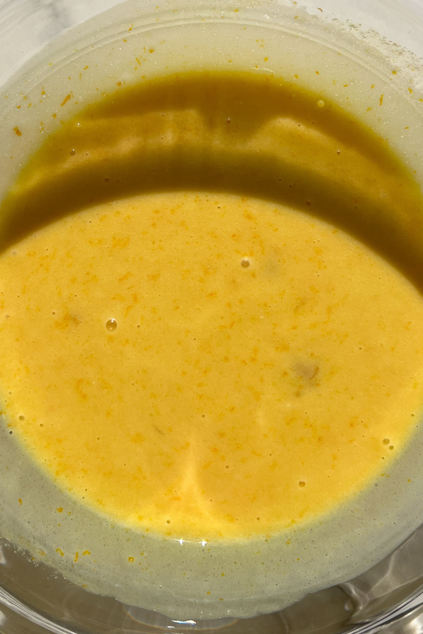 Wet ingredients in a large mixing bowl mixed together.