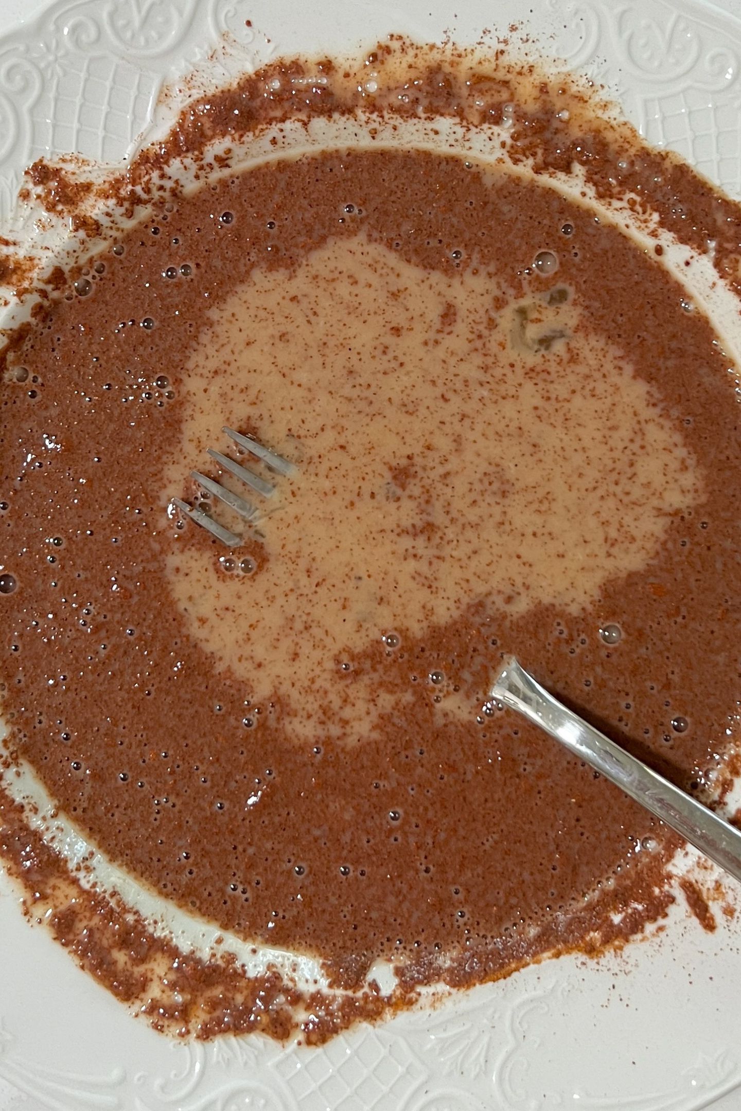 French toast egg mixture whisked in a bowl.