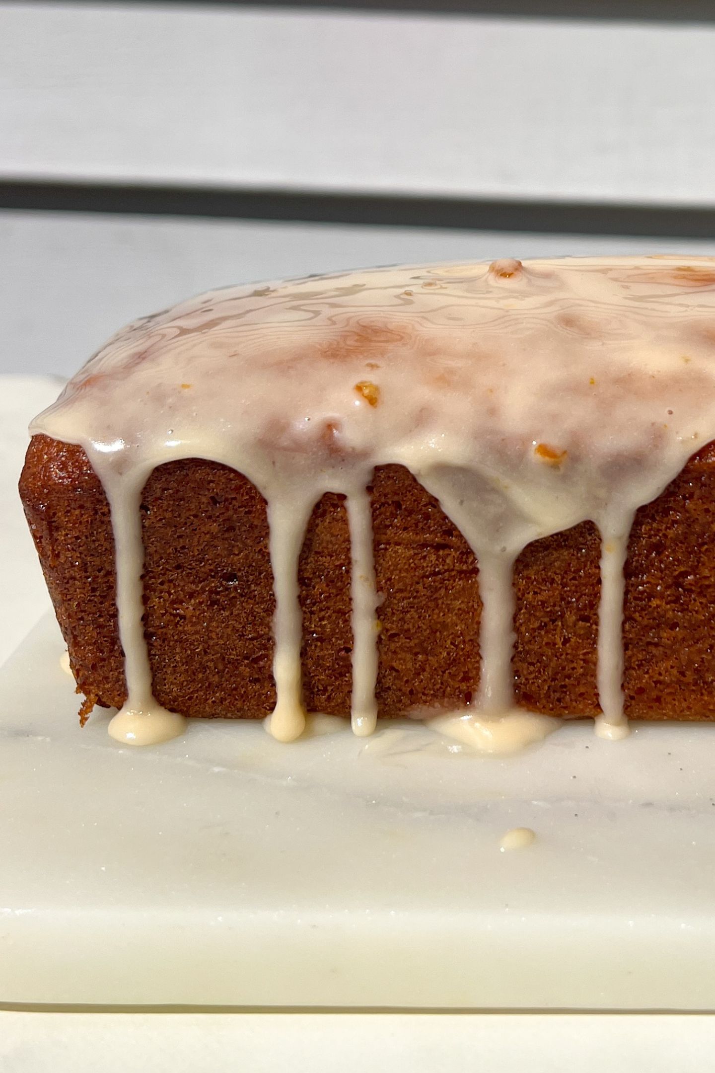 Orange loaf topped with a vanilla orange glaze.