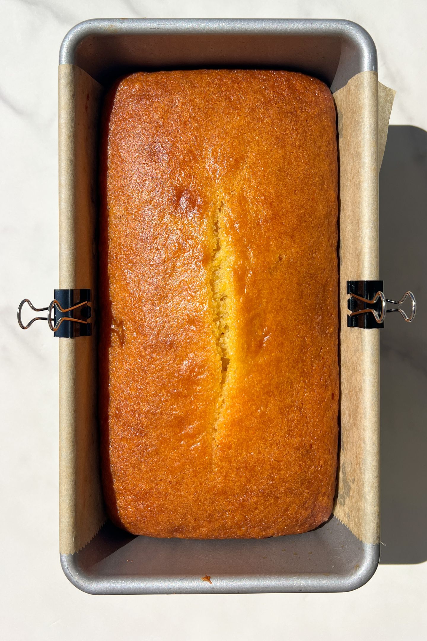 Baked orange loaf in pan.