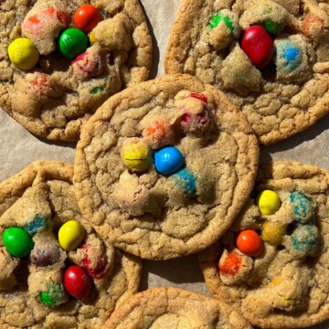 Peanut M&M Cookies on a baking sheet lined with parchment paper.