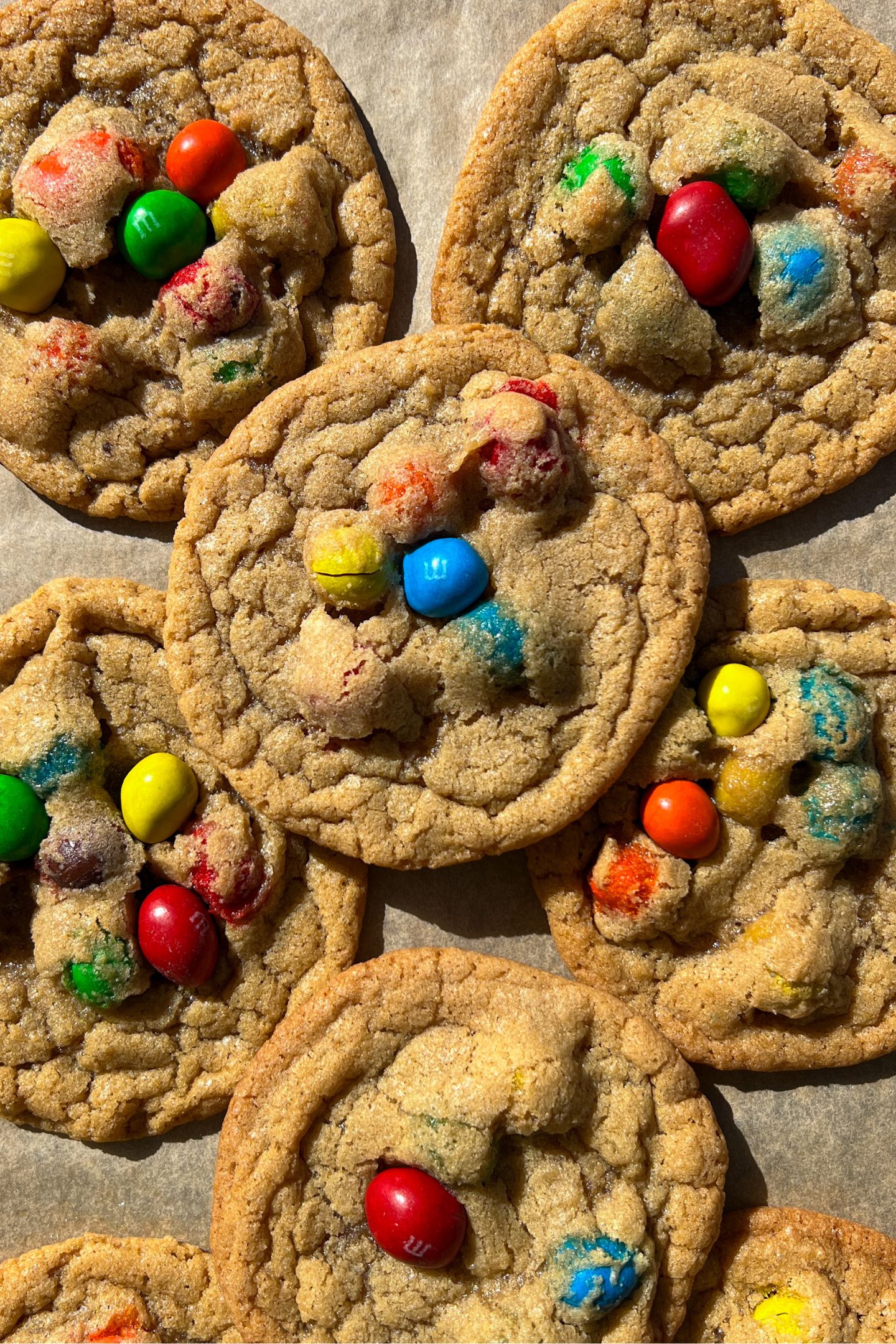 Peanut M&M Cookies on a baking sheet lined with parchment paper.