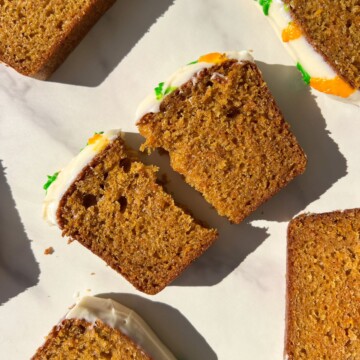 A slice of Carrot Cake Loaf broken in half.