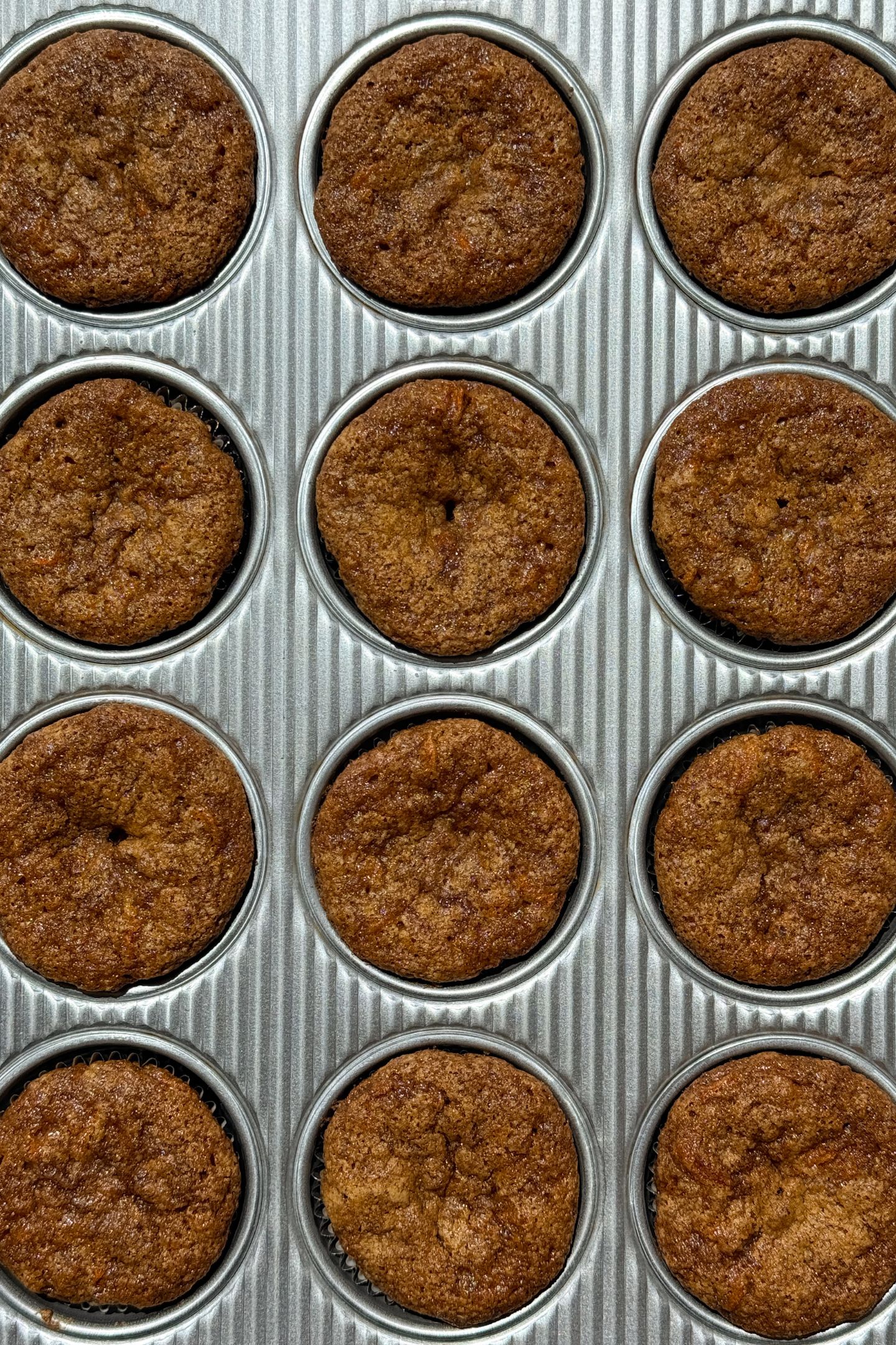 Baked cupcakes in a muffin tin.