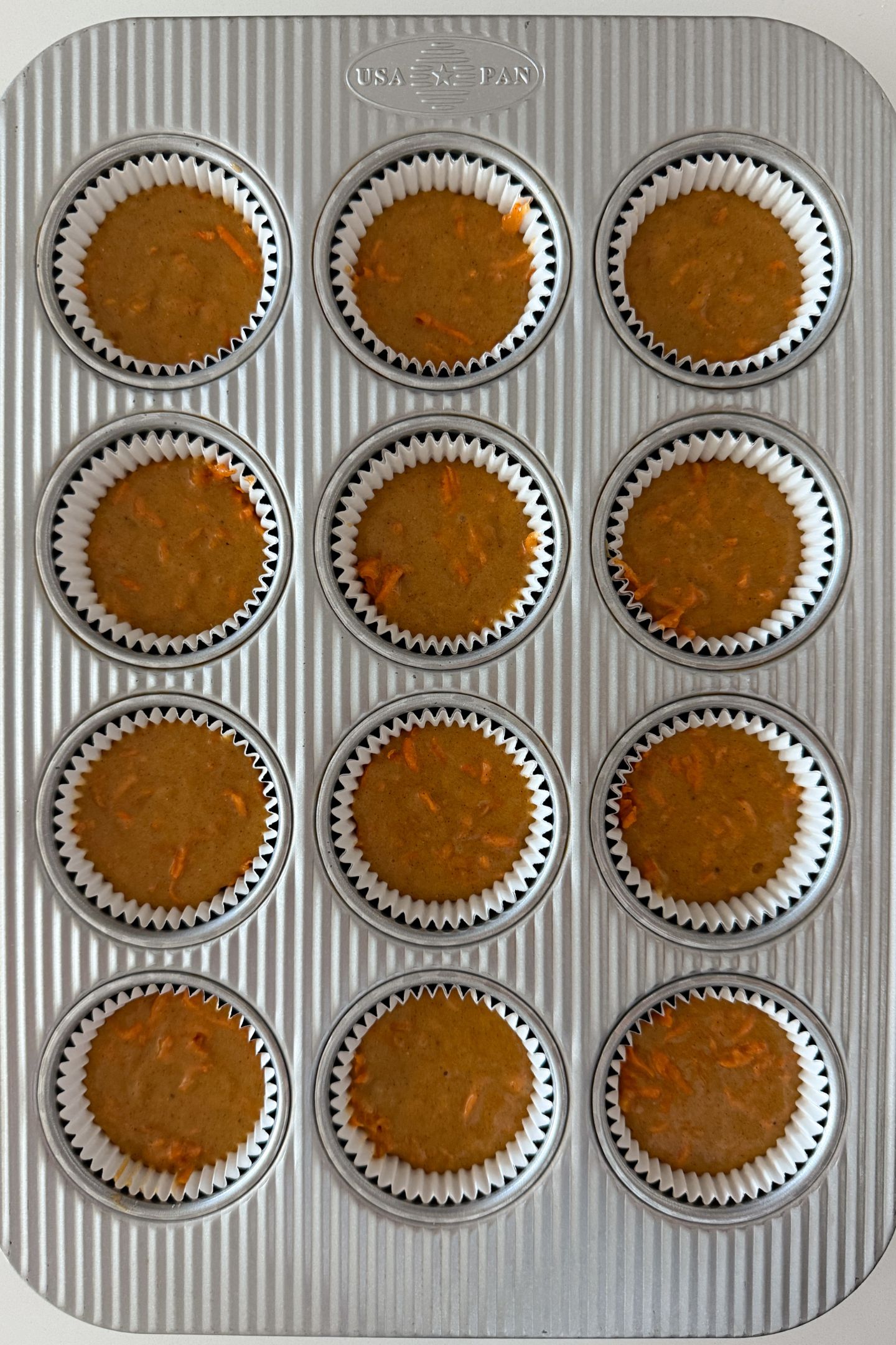 Cupcake batter in the liners.