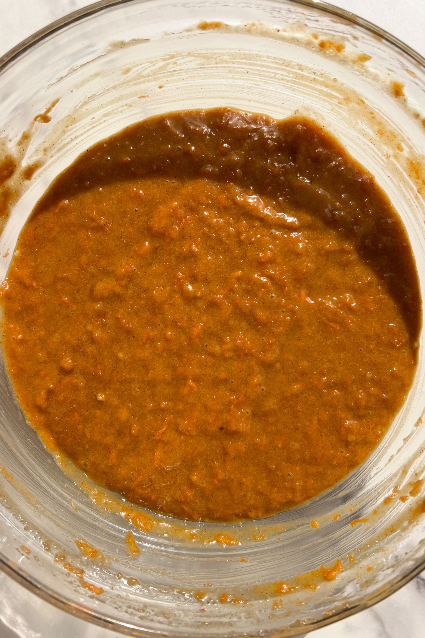 Carrot cake cupcake batter in mixing bowl.