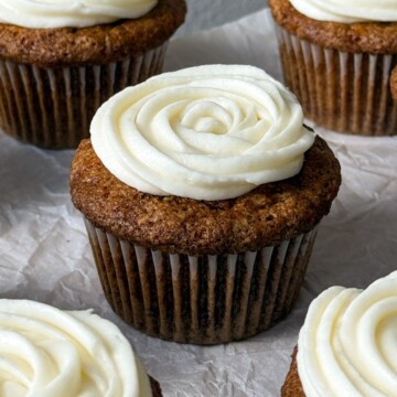 Carrot cake cupcake topped with frosting.