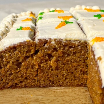 Sliced Mini Carrot Cake with carrot decorations.
