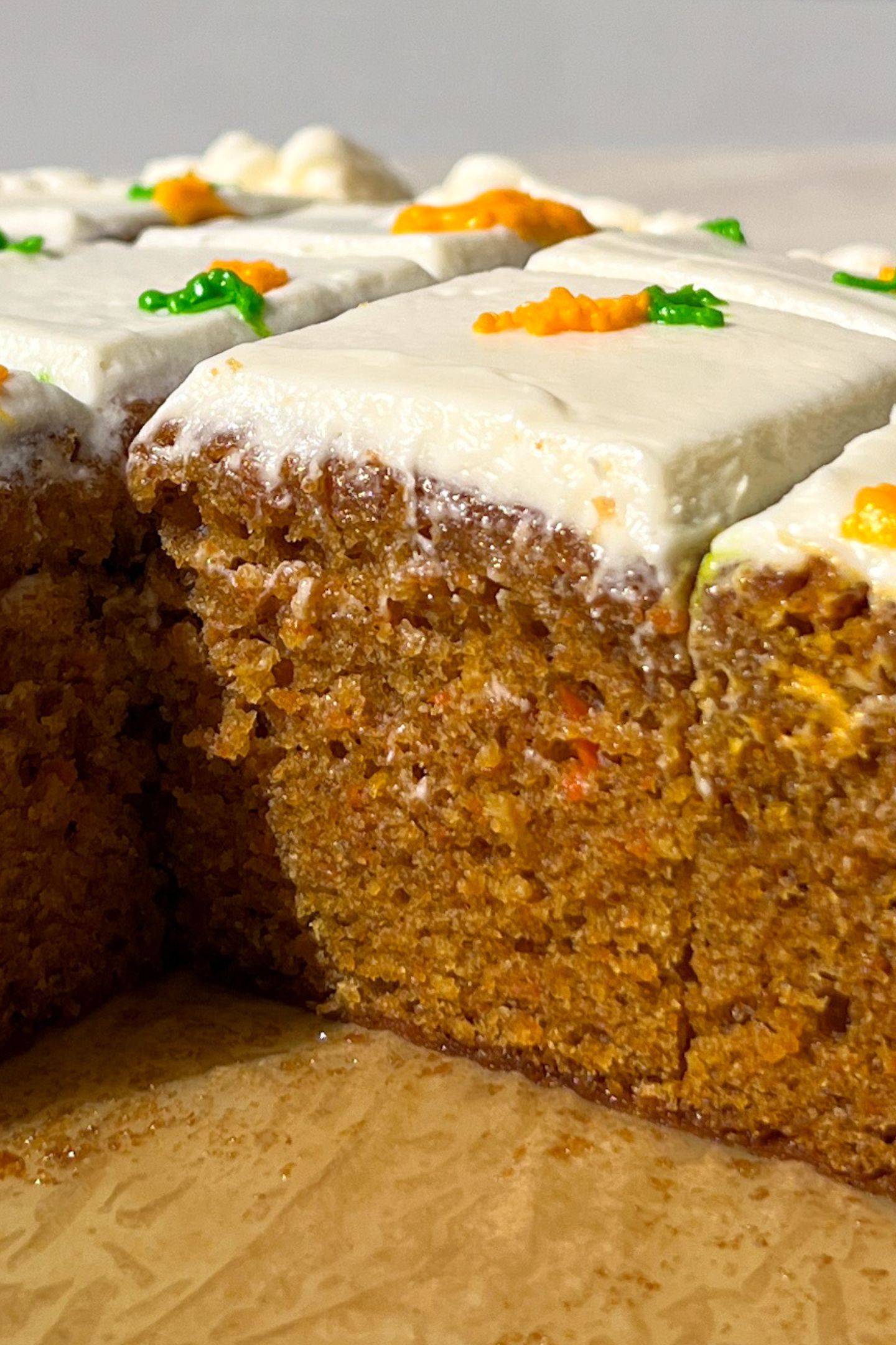 Sliced Mini Carrot Cake with carrot decorations.