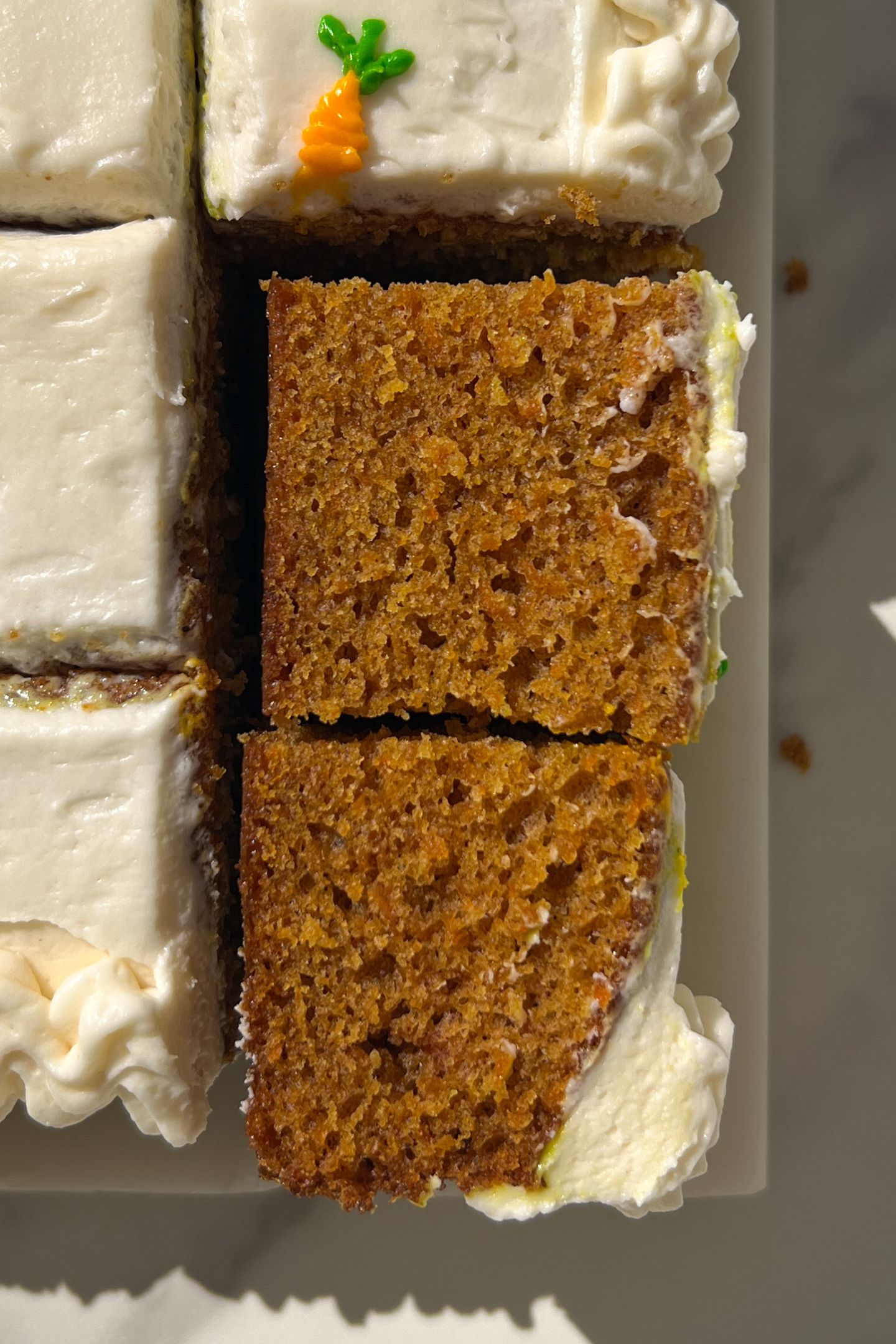 Sliced Carrot Cake with two slices on their side.