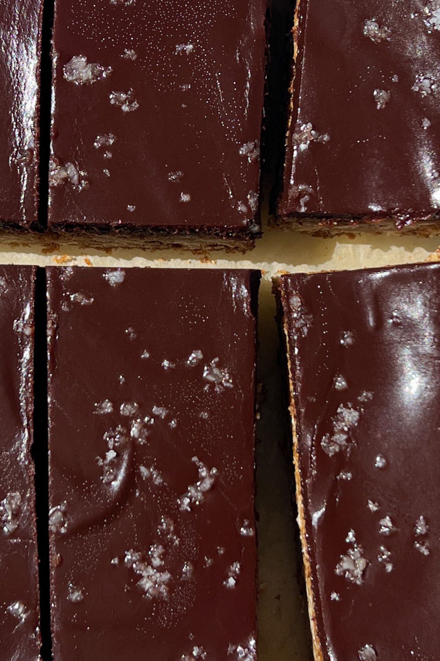 Sliced Oatmeal Fudge Bars topped with sea salt flakes.