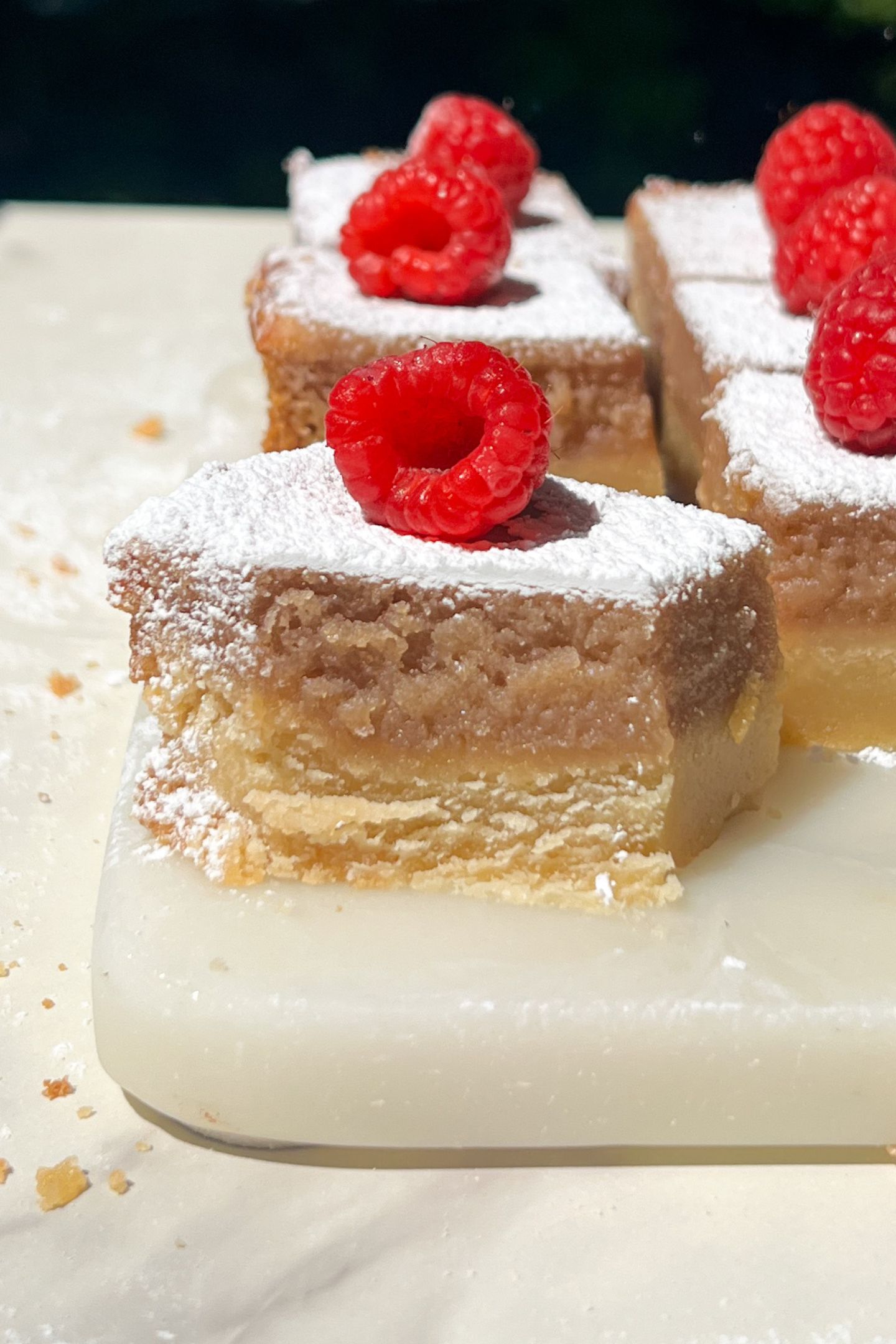 Eating a raspberry lemon bar.
