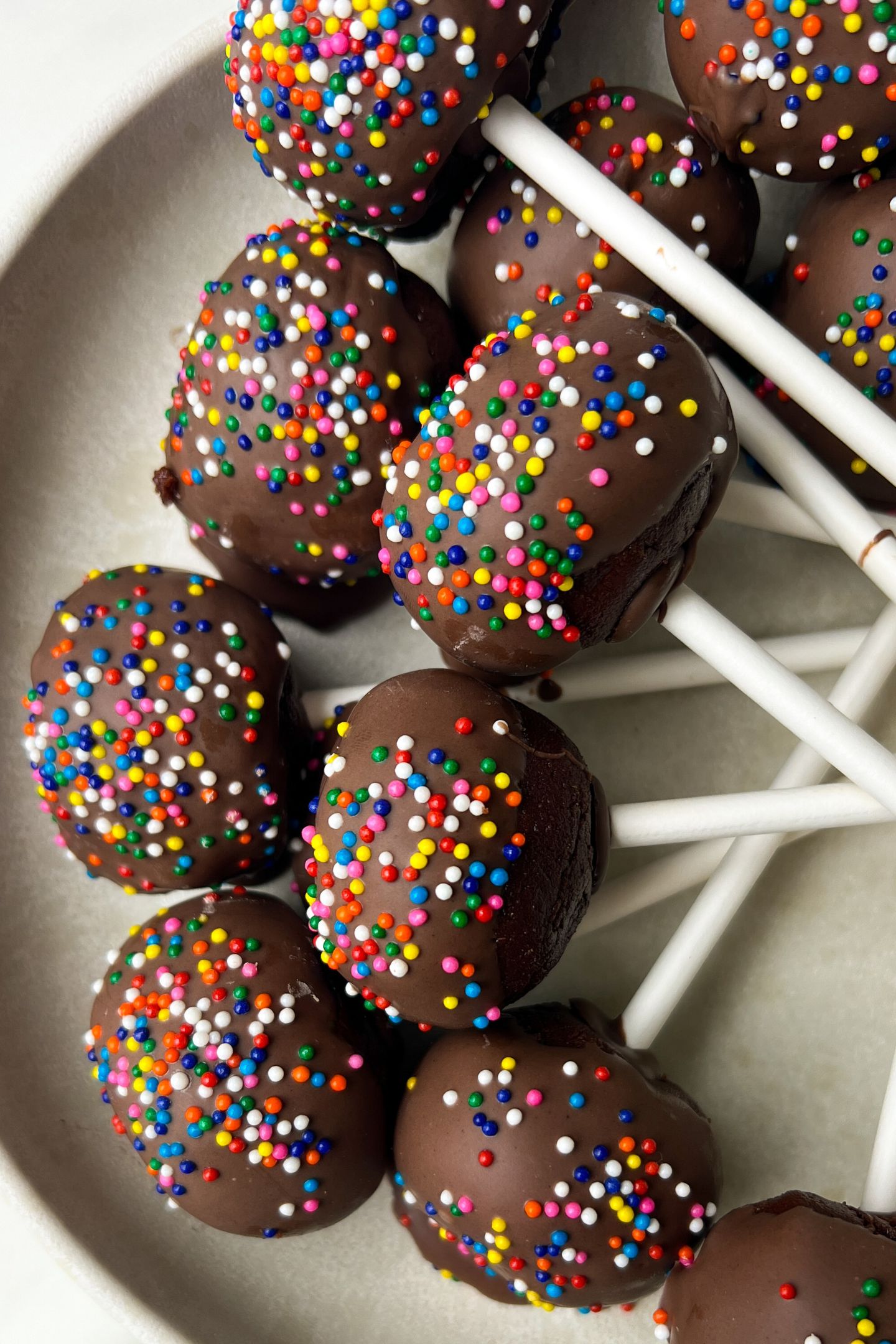 Brownie cake pops on a platter.