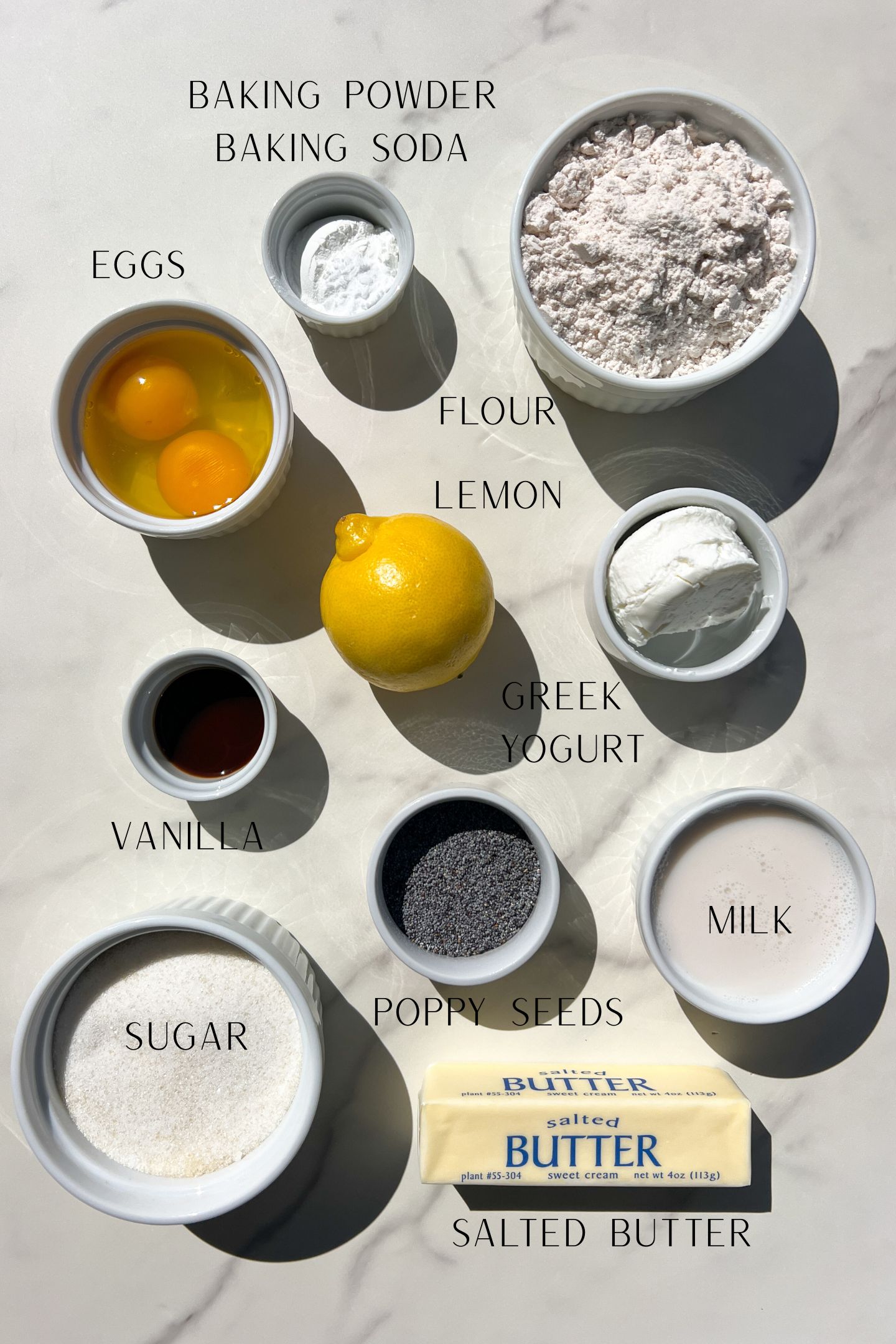 Ingredients measured out in bowls to make gluten free lemon poppy seed muffins.