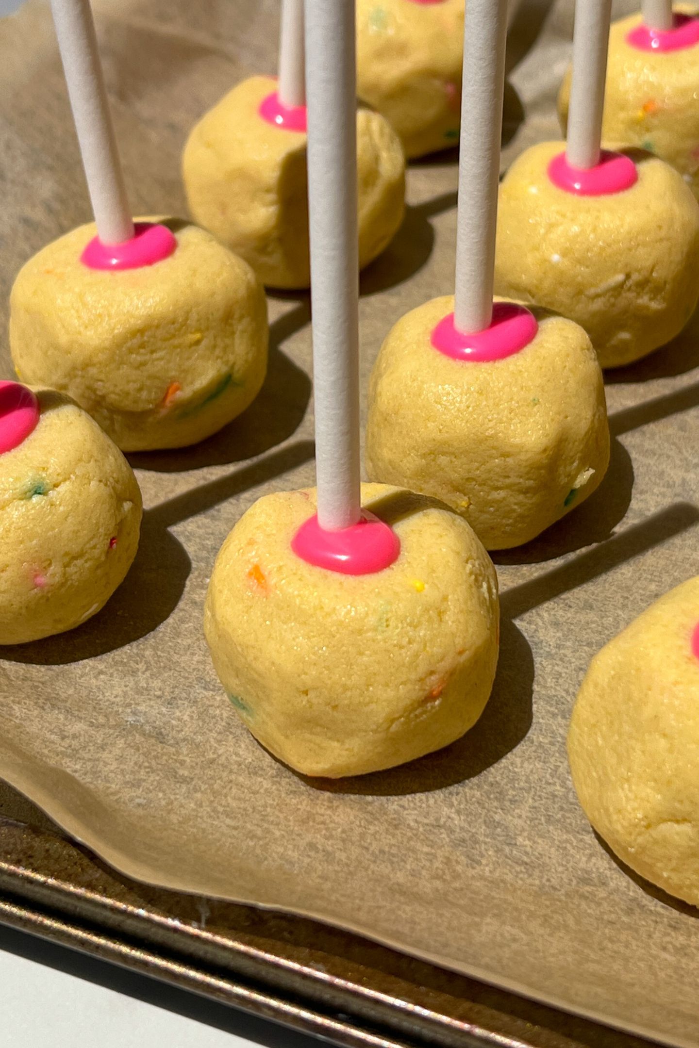 Cake pop balls with sticks added in.