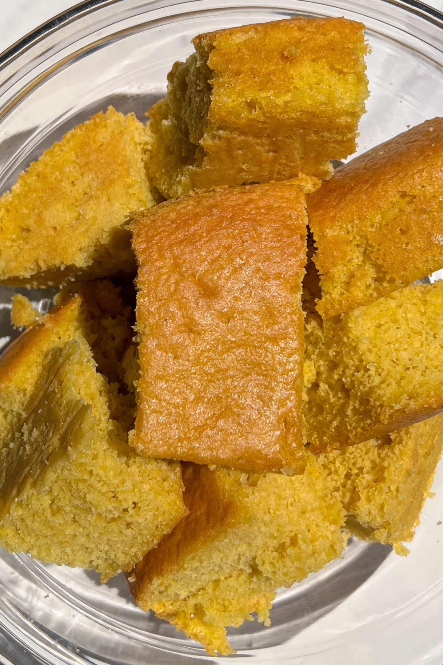 Vanilla cake pieces in a bowl.