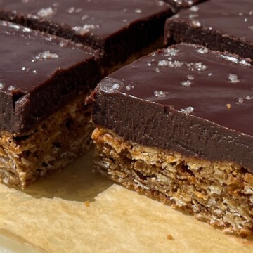 Side view of sliced oatmeal fudge bars topped with sea salt.