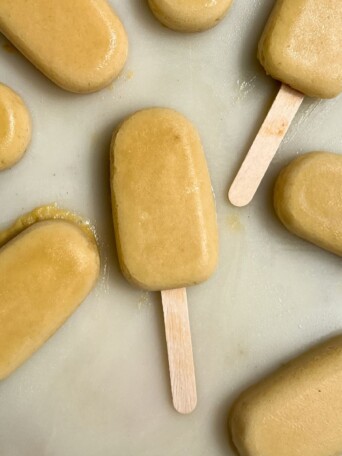 Pineapple popsicles on a tray.