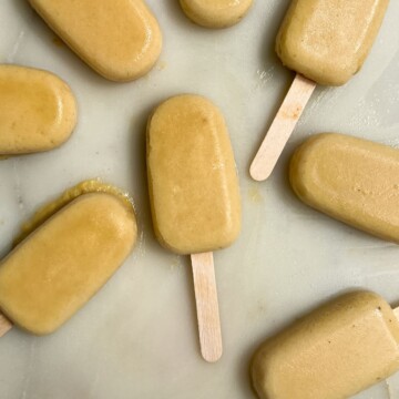 Pineapple popsicles on a tray.