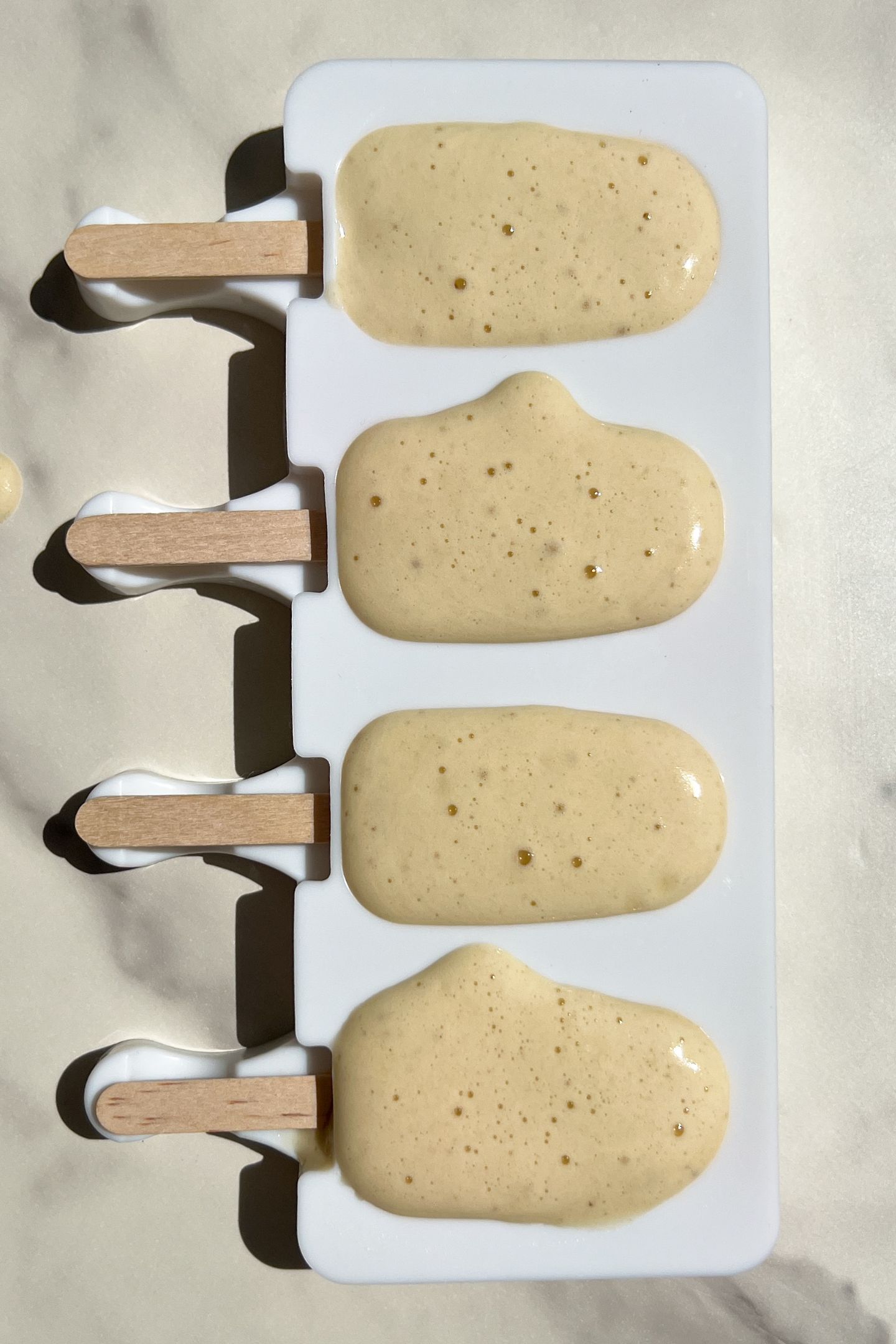 Popsicle mix poured into the molds.