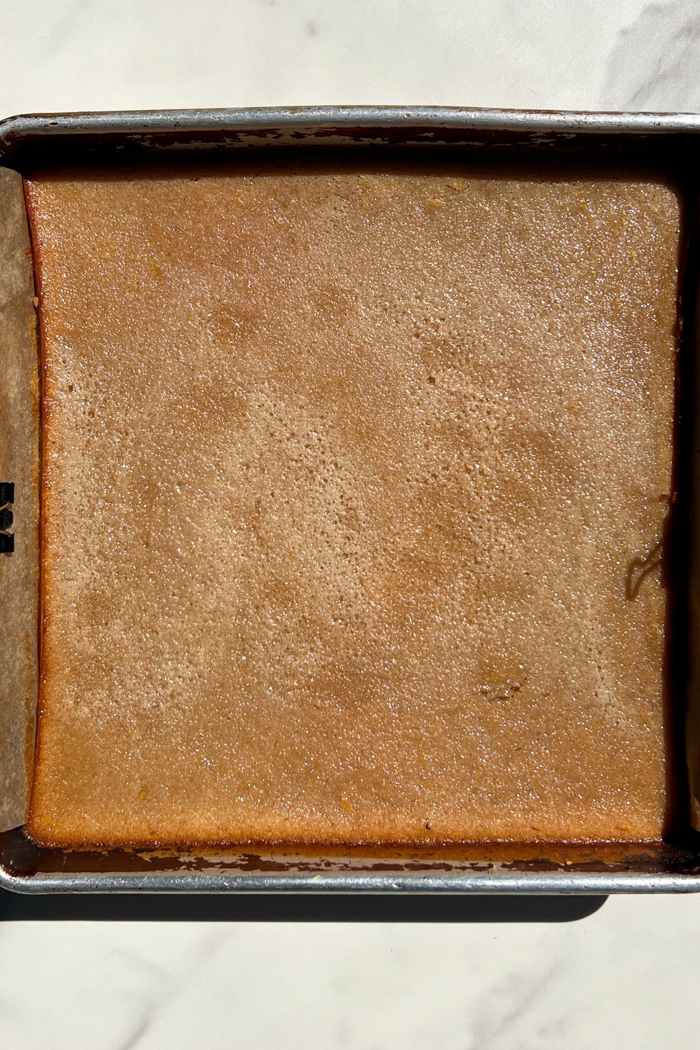 Baked raspberry lemon bars cooling in the pan.