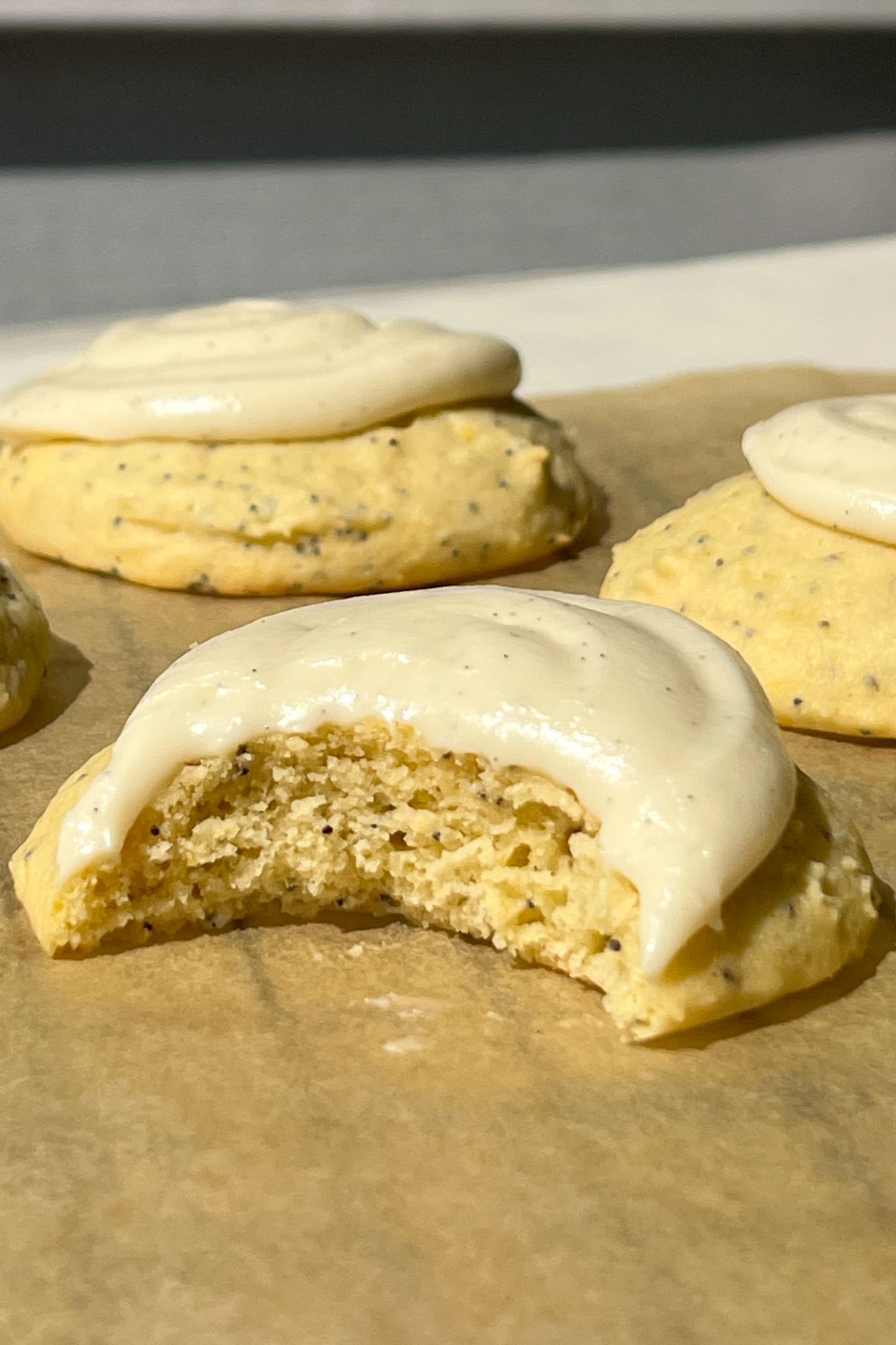 Vanilla bean frosting swirled on top of lemon poppy seed cookies.