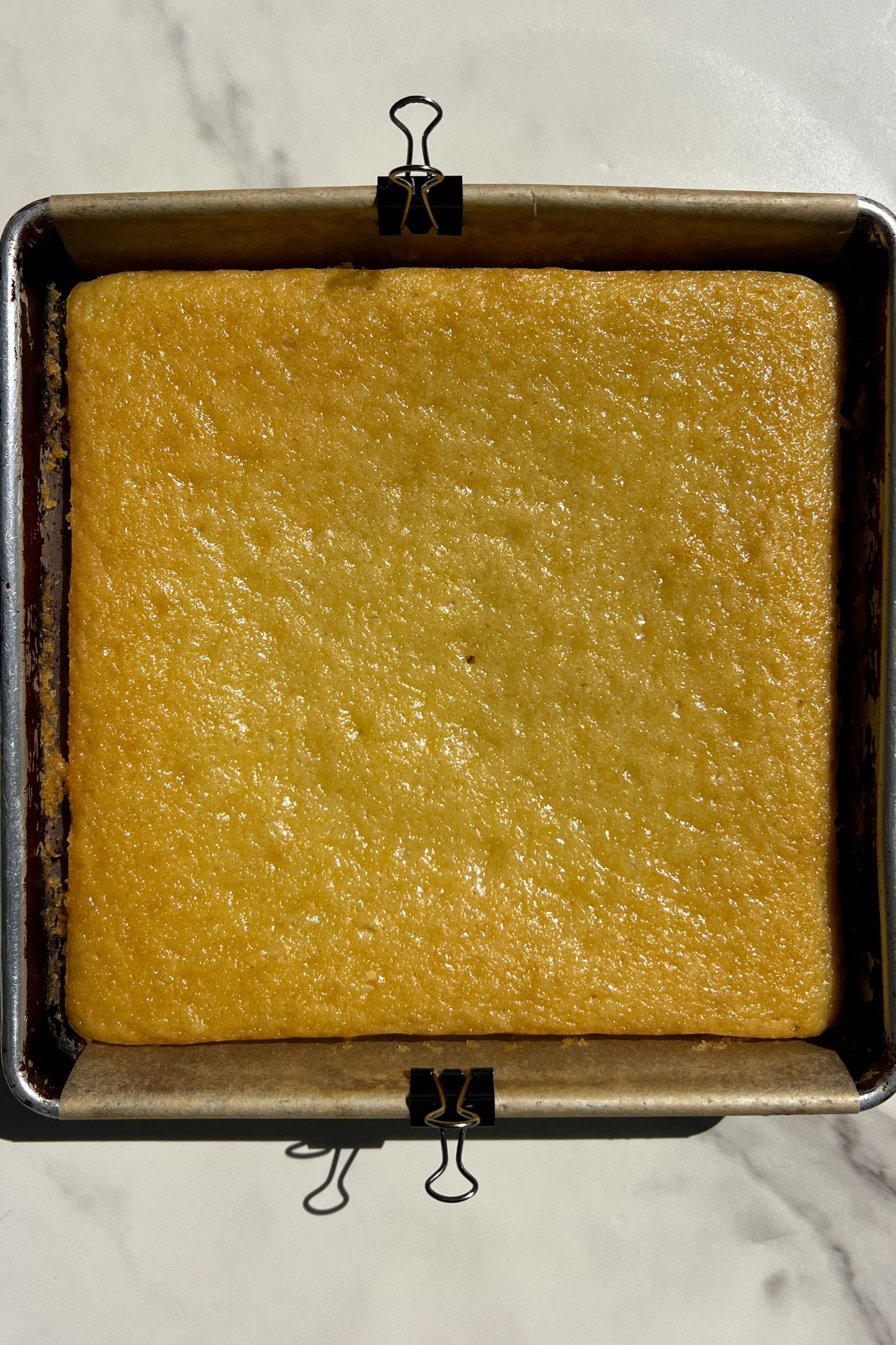 Baked cake in square pan.