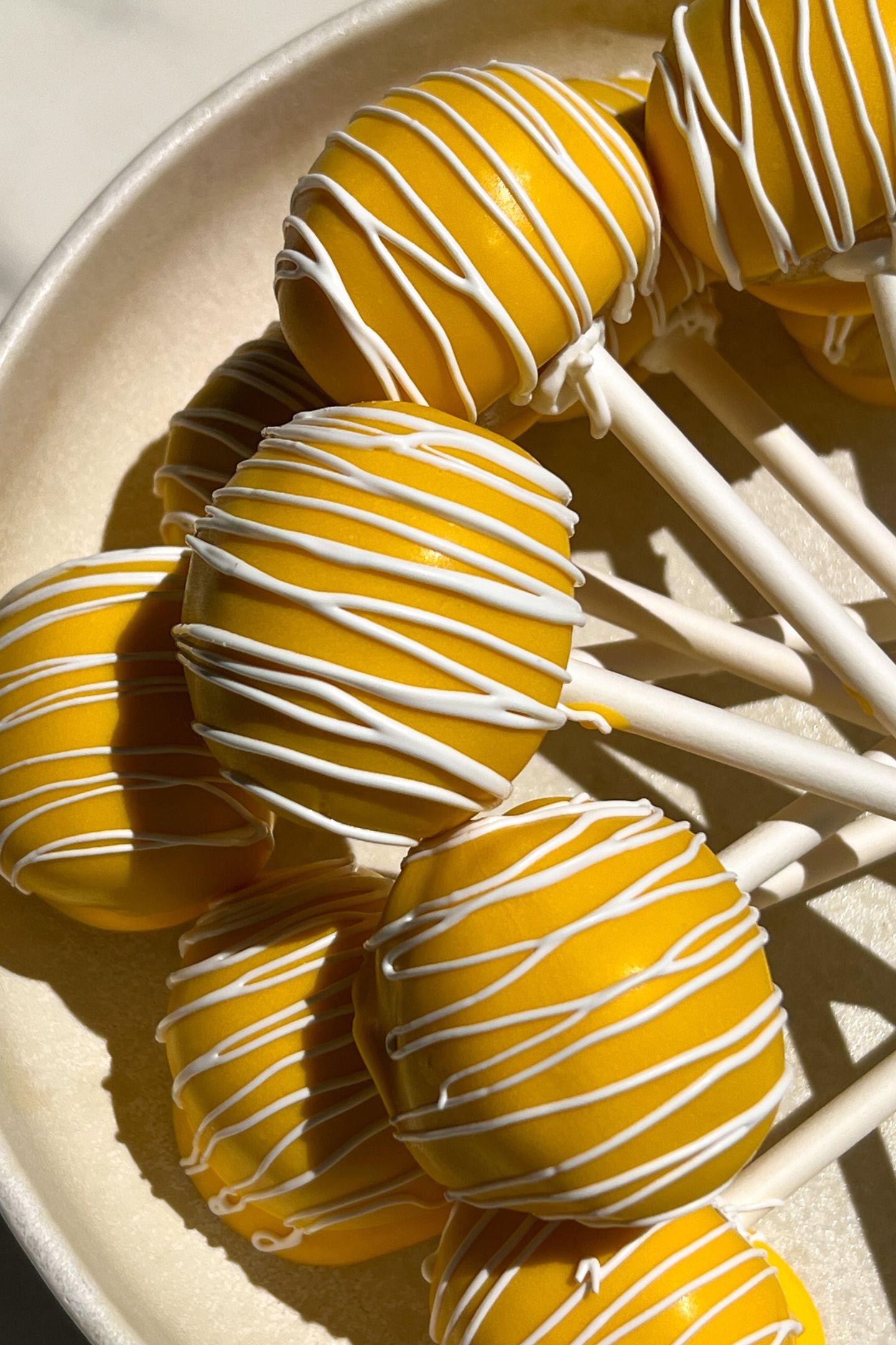 Cake pops on a serving platter.